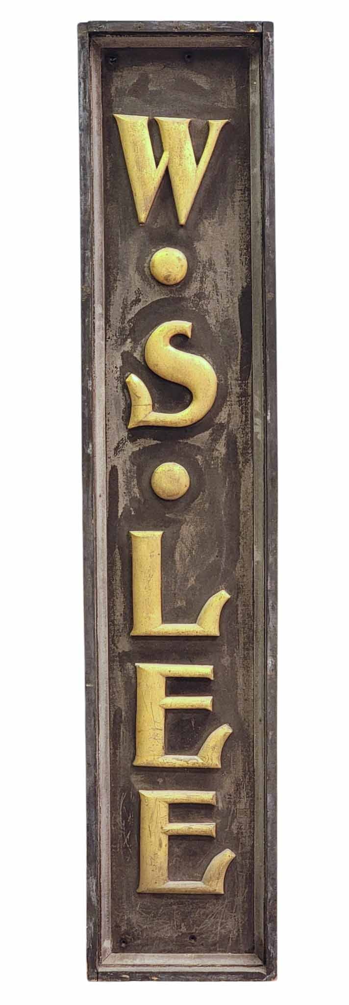 ADVERTISING SIGN "W.S. LEE": American, late 19th century, poplar. Vertical sign with applied letters "W.S. LEE" that retain their original gilding, and the sign with original black paint with sanded finish. 73.5" high, 15" wide. 