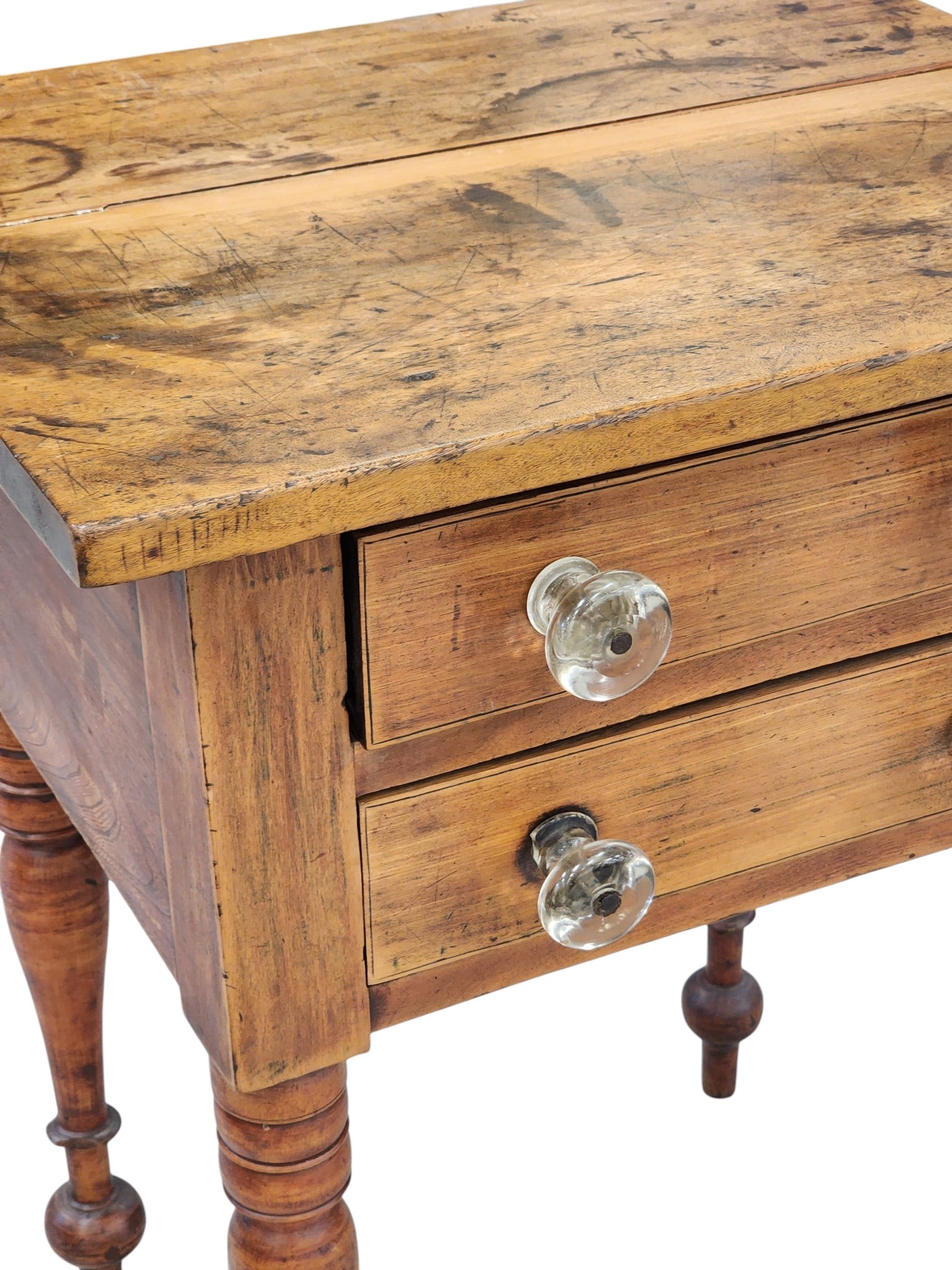 TWO-DRAWER STAND: Ohio or Pennsylvania, 1820-1850, maple and poplar. Two drawers with period blown glass pulls, on turned legs. 29" high, 23" wide, 19" deep. Provenance: Collection of Bob and Maxine Edwards, New Philad