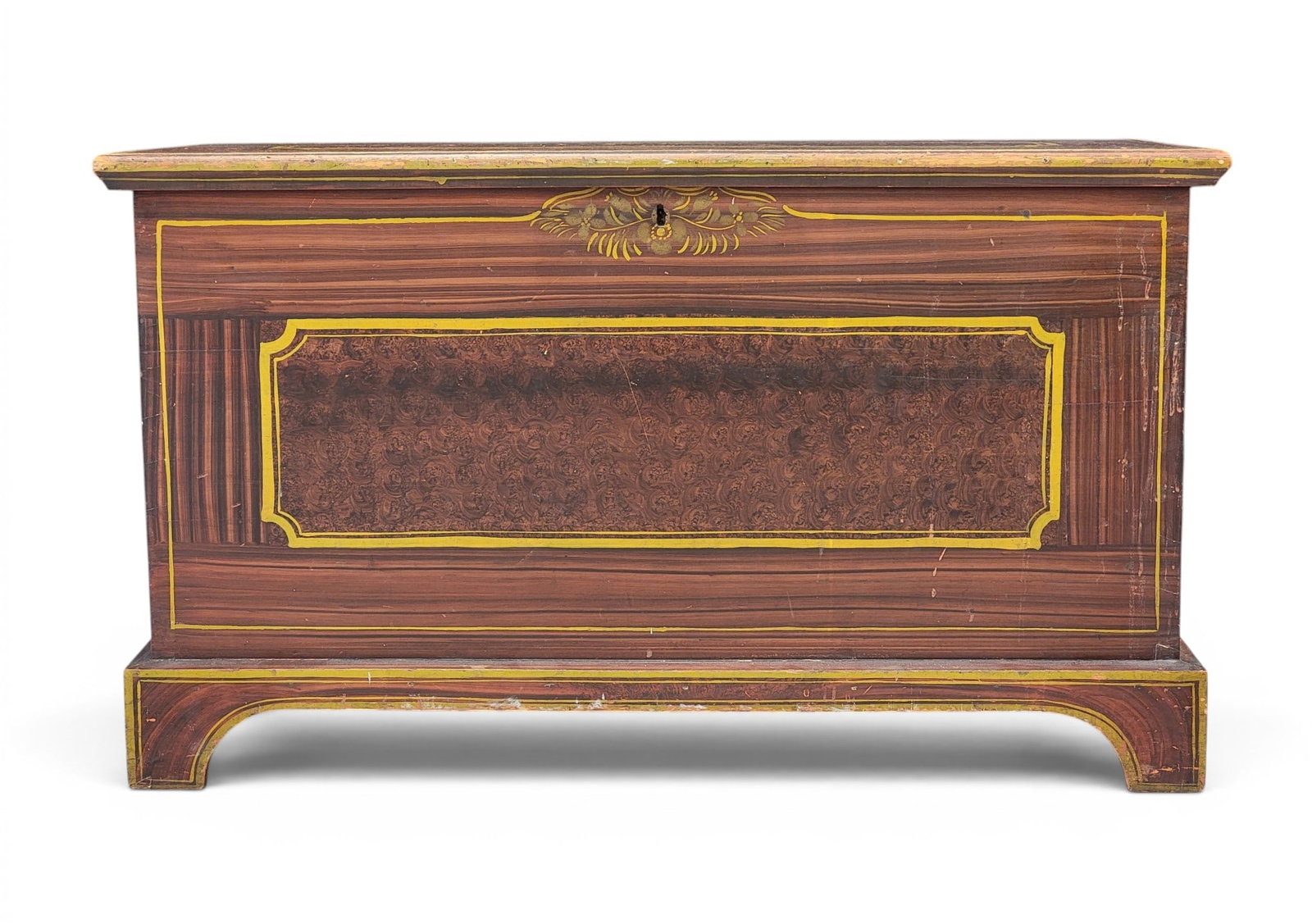 DECORATED BLANKET CHEST: Probably Ohio or Pennsylvania Mennonite, mid-19th century, poplar. Dovetailed case on bracket feet, and retains its original paint decoration (chrome yellow striping and flowers against a