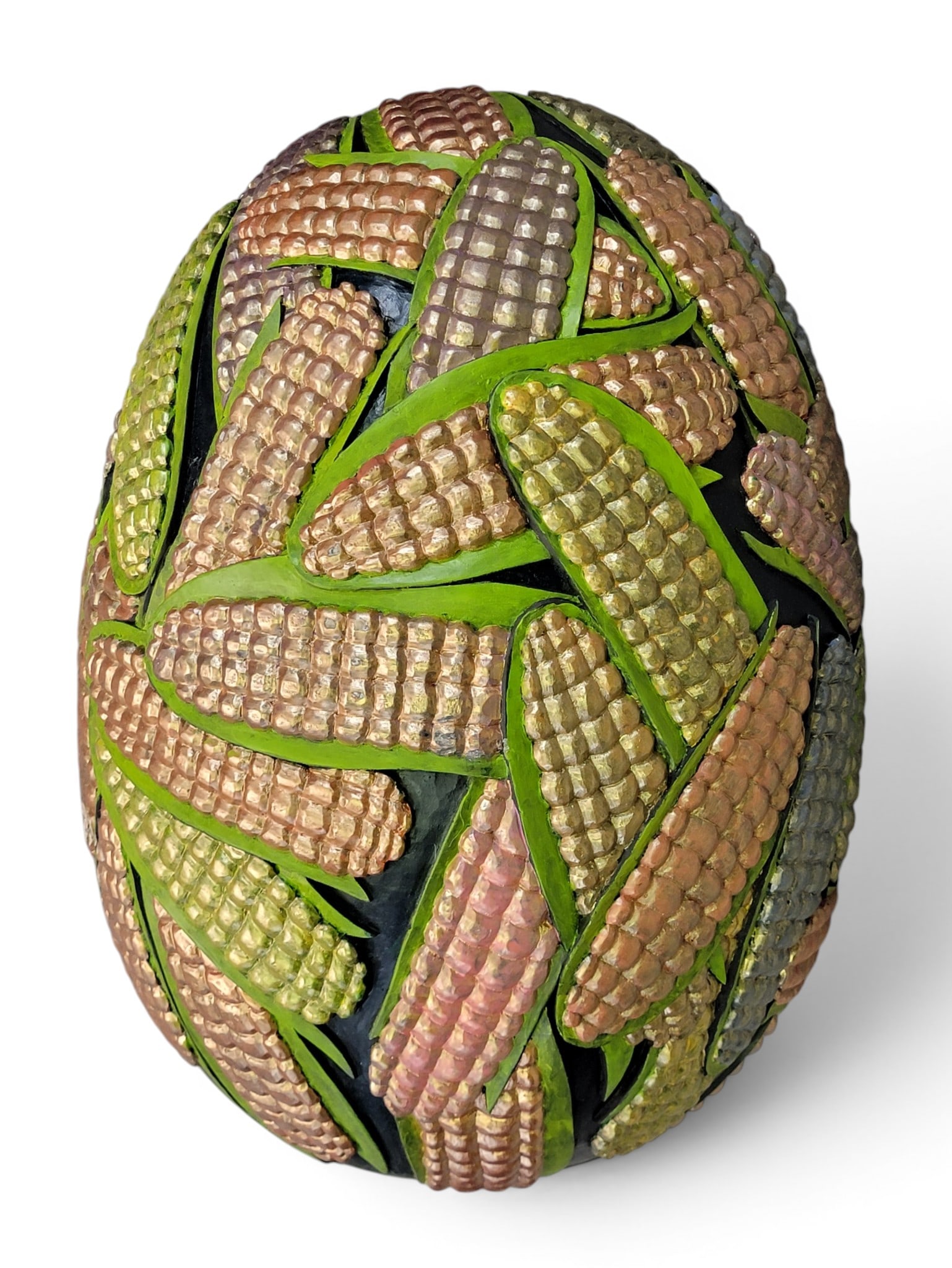 CARVED EGG BY GENE KANGAS (OHIO, B. 1944): Signed and dated 2021. A large egg with relief-carved corn. 25" long. Provenance: a West Virginia collection. NOTE: We are happy to answer questions and take additional photos of lots prior to the