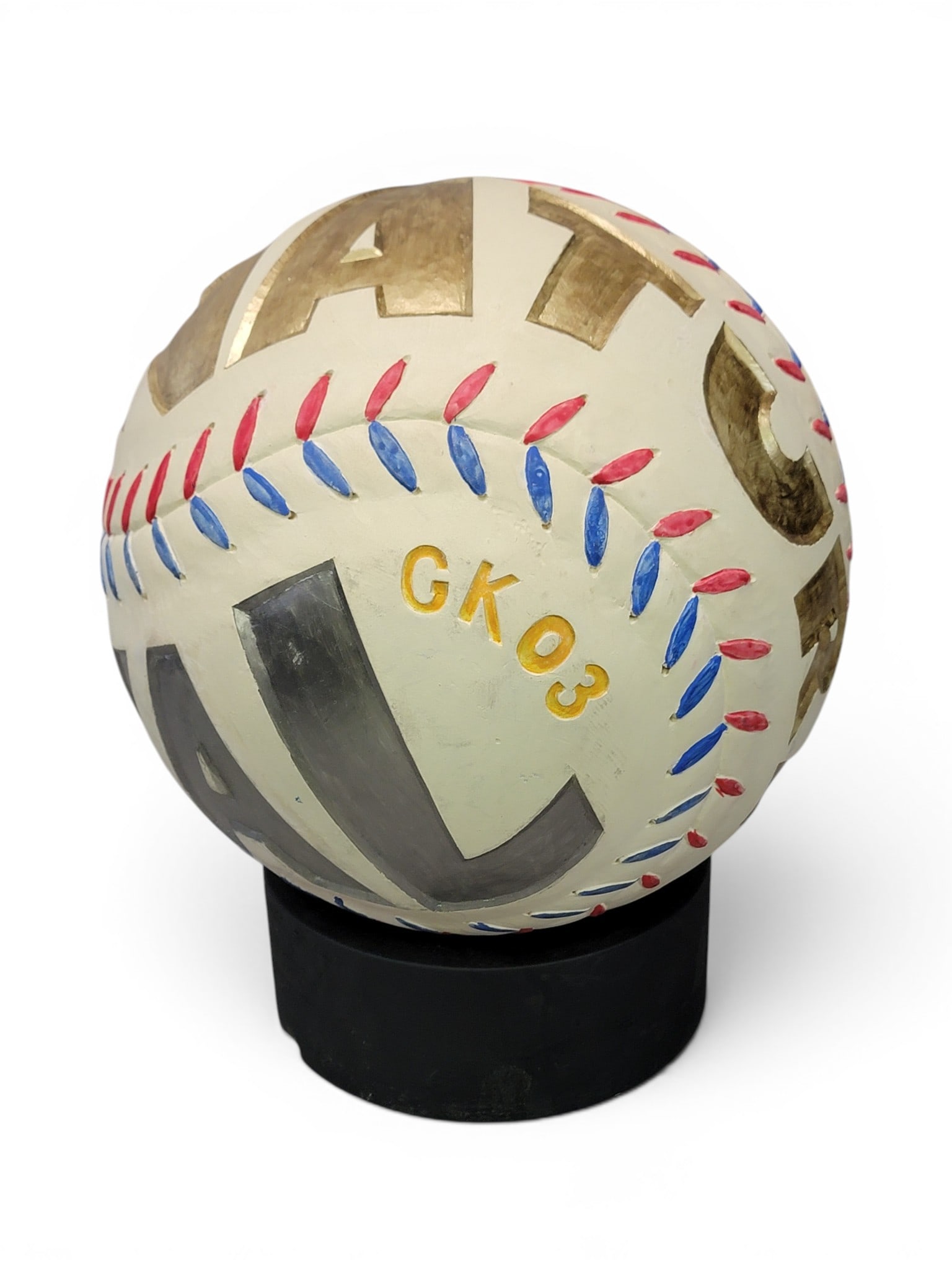 CARVED BASEBALL BY GENE KANGAS (OHIO, B. 1944): Initialed and dated 2003. With carved "OFFICIAL," "ARTIFICIAL," and "NATURAL." On a stand, 16" high (overall). Provenance: a West Virginia collection. NOTE: We are happy to answer questions and take