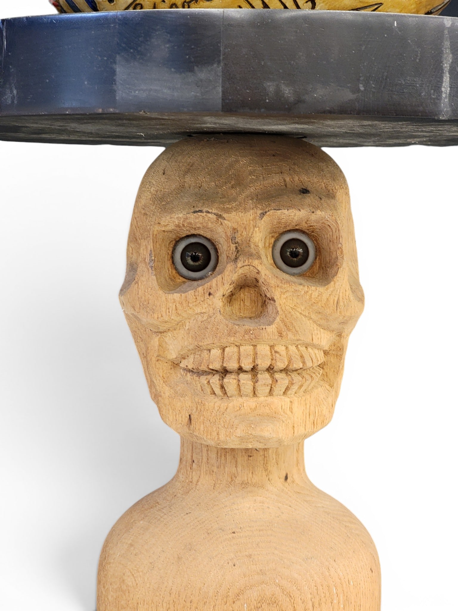 SCULPTURE BY GENE KANGAS (OHIO, B. 1944): Signed and dated 2004. A carved baseball covered in "signatures" (including Picasso, Joseph Smith, Jesus, Malcolm X, among others), that sits on a table, the base in the form of a large clothespin wit