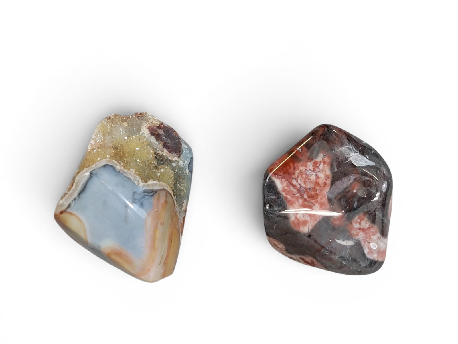 TWO POLISHED FLINT RIDGE FLINT SPECIMENS: One with vein of quartz crystals, 2.5" by 2.5" by 2". Provenance: an Ohio collection. NOTE: We are happy to answer questions and take additional photos of lots prior to the auction (the sooner
