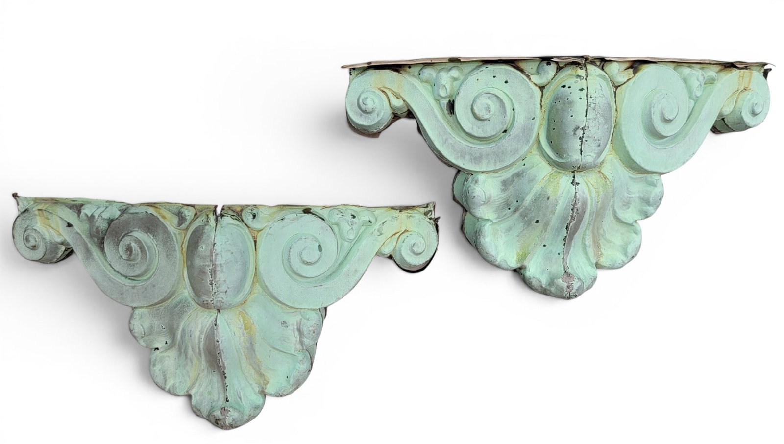 PAIR OF COPPER ARCHITECTURAL BRACKETS: Late 19th century. Molded brackets with a shell and scroll design, and retaining a wonderful, original, verdigris patina. 12.5" high, 24" wide. Provenance: an Ohio collection. NOTE: We are happy to