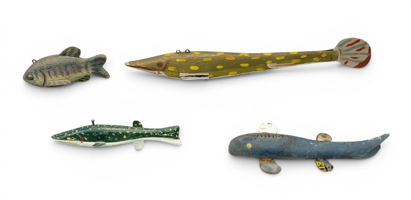 FOUR FISH DECOY: American, possibly Minnesota, 20th century. Includes two pike, a sunfish, and a sucker. 5.5" to 15" long. Provenance: an Ohio collection. NOTE: We are happy to answer questions and take additional
