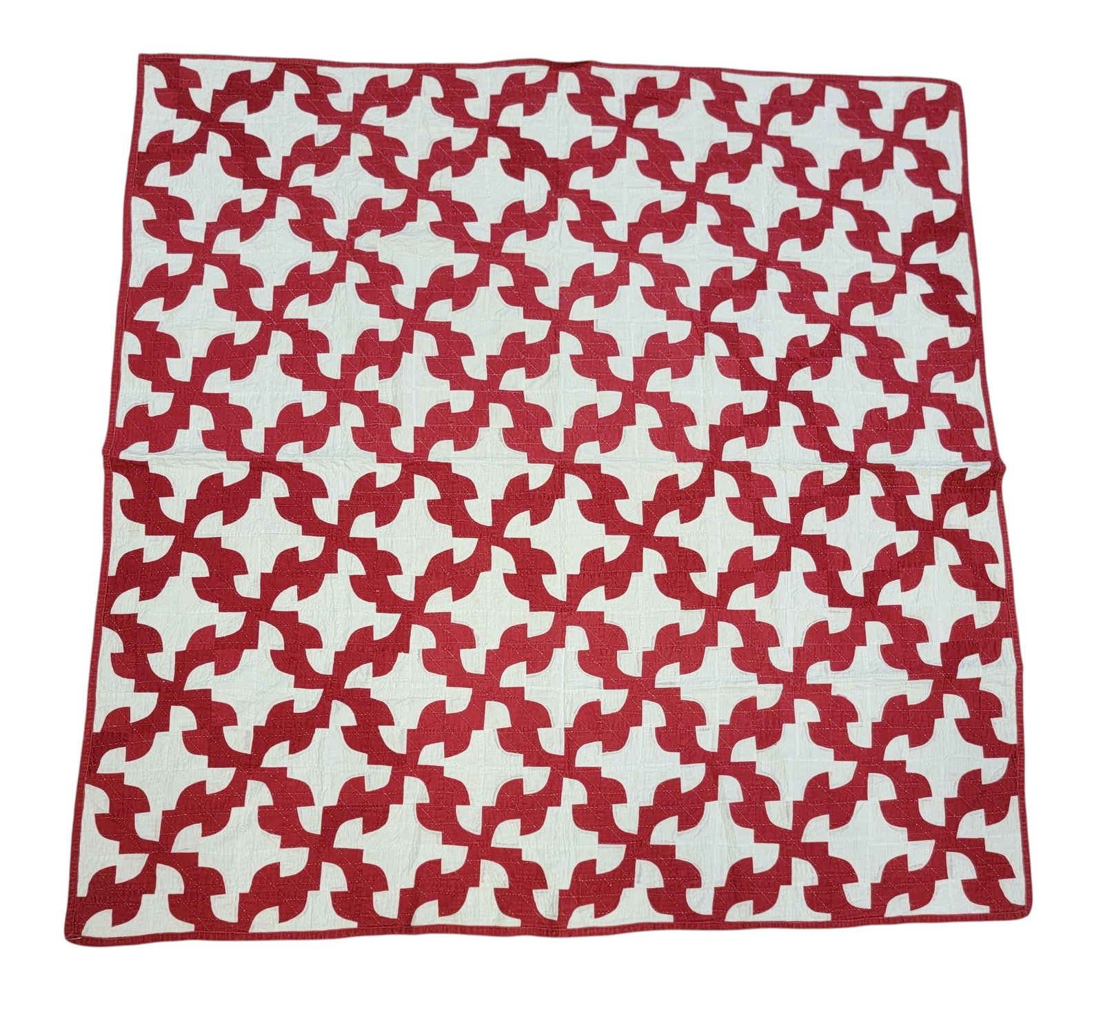 DRUNKARD'S PATH QUILT: American,late 19th-early 20th century, cotton. Red and white, handstitched, machine-bound. 72" by 71". Provenance: an Ohio collection. NOTE: We are happy to answer questions and take additional