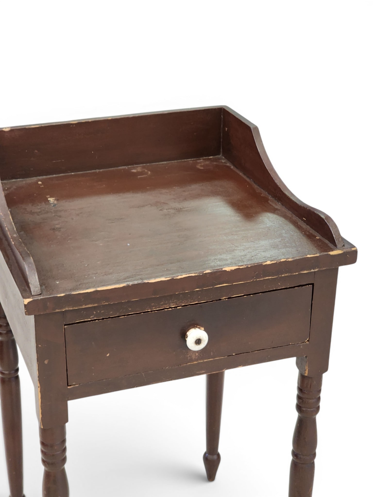 PAINTED ONE-DRAWER STAND: American, mid-19th century, poplar. Dovetailed gallery and drawer, and turned legs. Retains old/original brown paint. 32.5" high, 20" wide, 17.75" deep. Provenance: Collection of Bob and Maxine Edward