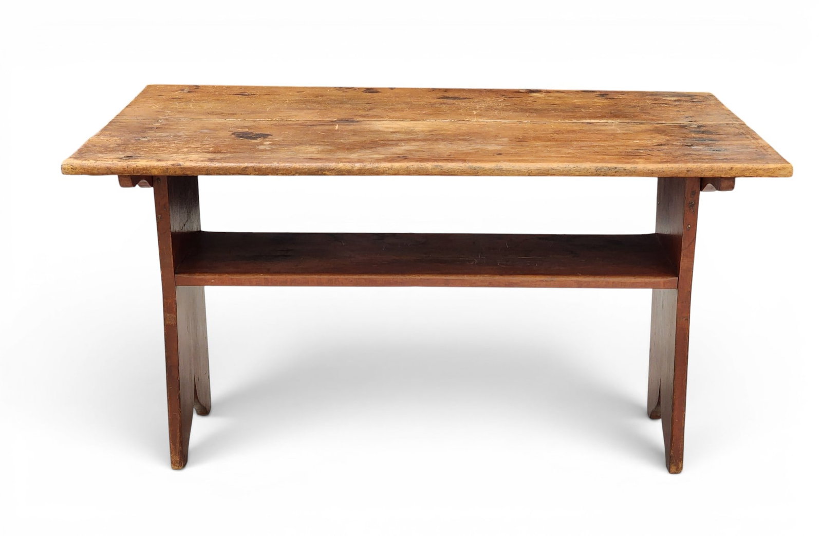 HUTCH TABLE: Probably New England, 1st half-19th century, mixed woods. Scrubbed rectangular top over a bench with bootjack ends and old red paint. 28" high, 36.25" wide, 25.5" deep. Provenance: Collection of Bob