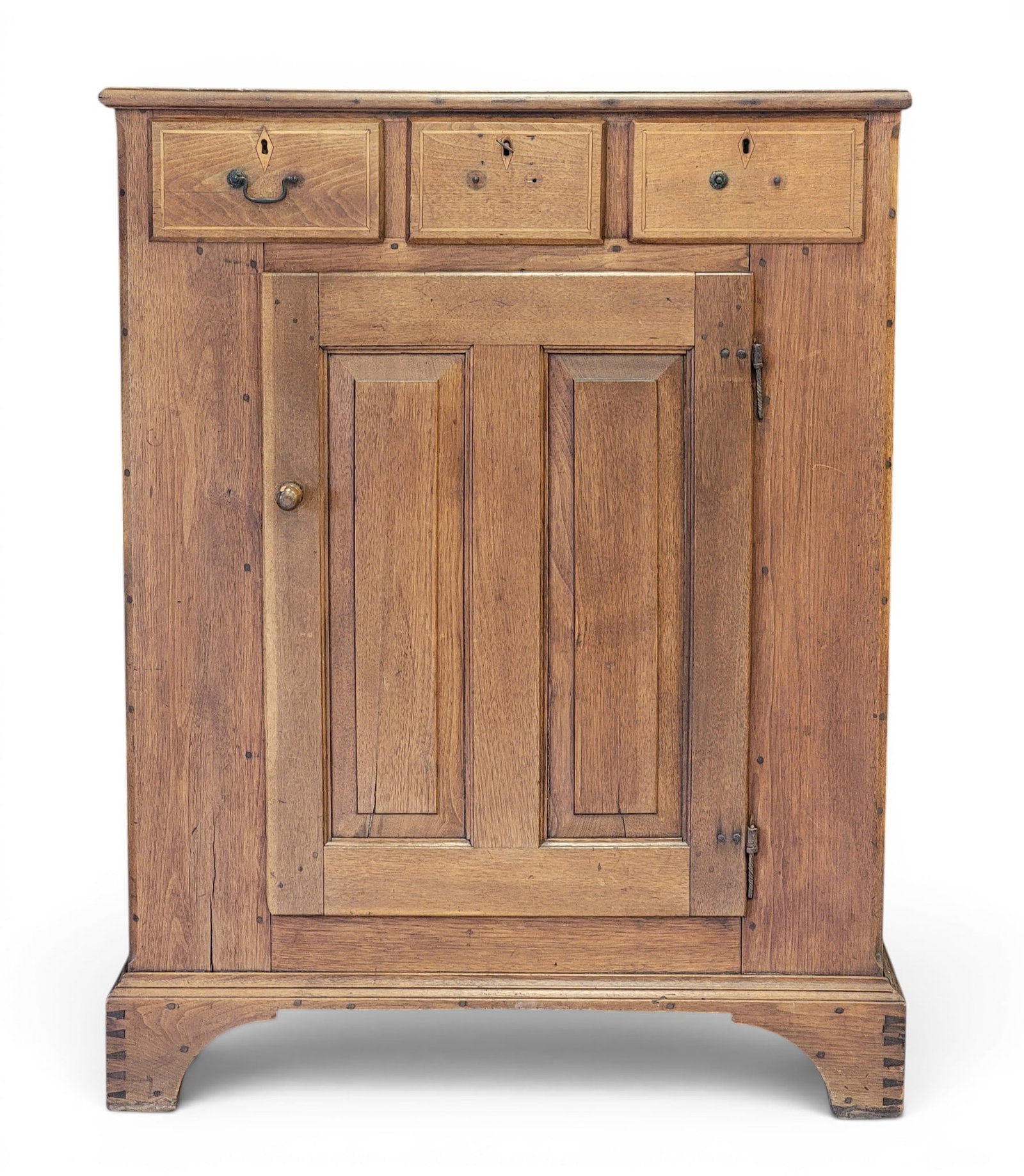 INLAID PENNSYLVANIA CUPBOARD: Eastern PA, late 18th-early 19th century, walnut and poplar. Dovetailed case, with three inlaid drawers over a double-raised-panel door, and on high bracket feet. 49" high, 38" wide, 20" deep.
