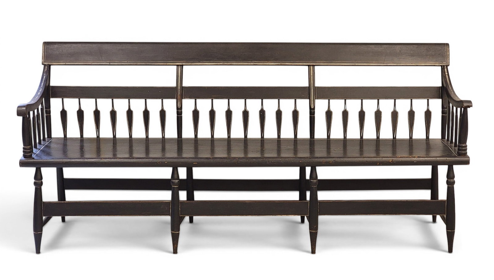PAINTED WINDSOR SETTEE: Ohio or Pennsylvania, 1820-1840, mixed woods including poplar. Half-arrow-back settee with old black paint and white striping. 35" high, 78" long. Provenance: Collection of Bob and Maxine Edwards, New