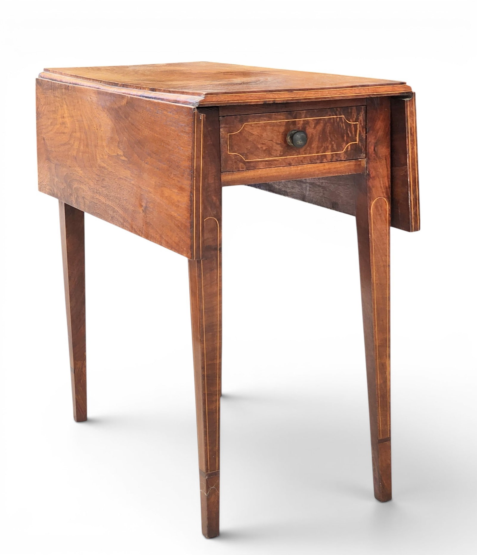 INLAID PEMBROKE TABLE: American, early 19th century, mahogany and poplar. Highly figured top over one drawer and tapered legs, with string inlay. 27" high, 28" wide, 30.25" deep (open), 14.75" deep (closed). Provenance:
