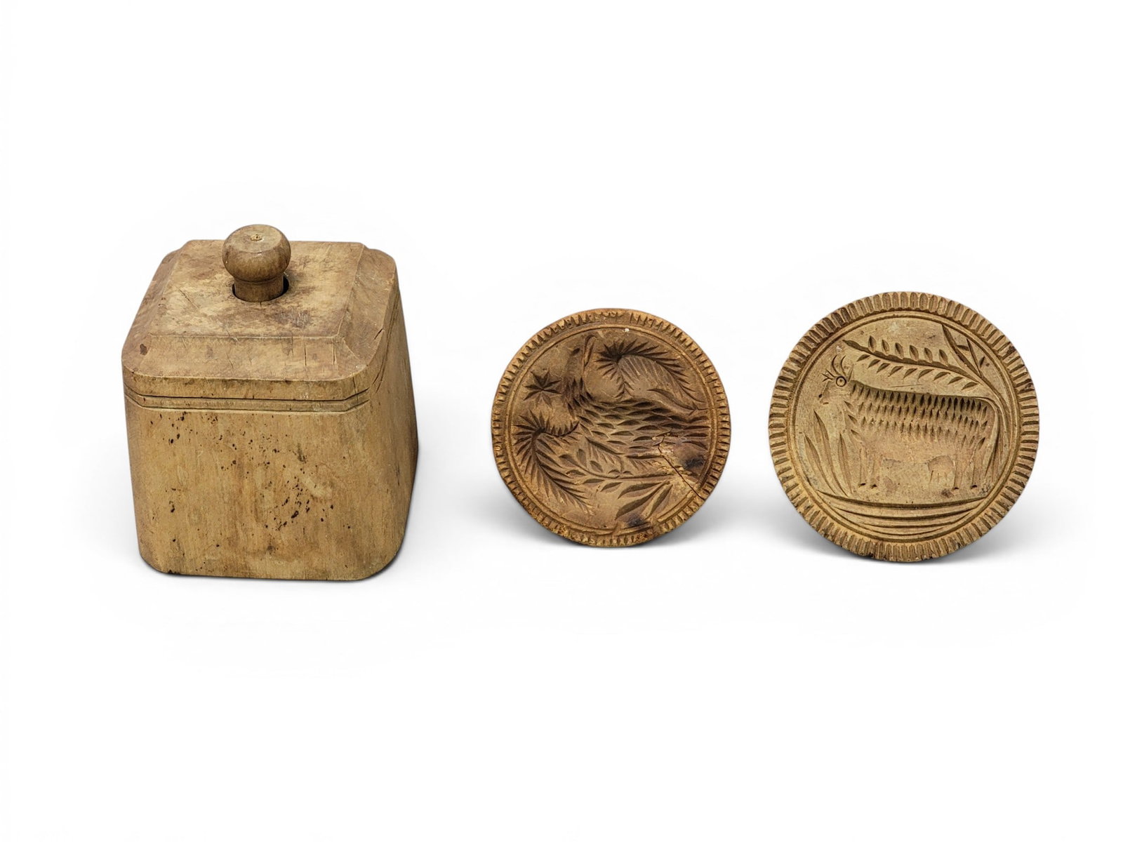 THREE CARVED BUTTER MOLDS: American, 19th century. Includes a cased swan, a cow, and a spread-winged eagle. Various sizes. Provenance: Collection of Bob and Maxine Edwards, New Philadelphia, Ohio. NOTE: We are happy to answer q
