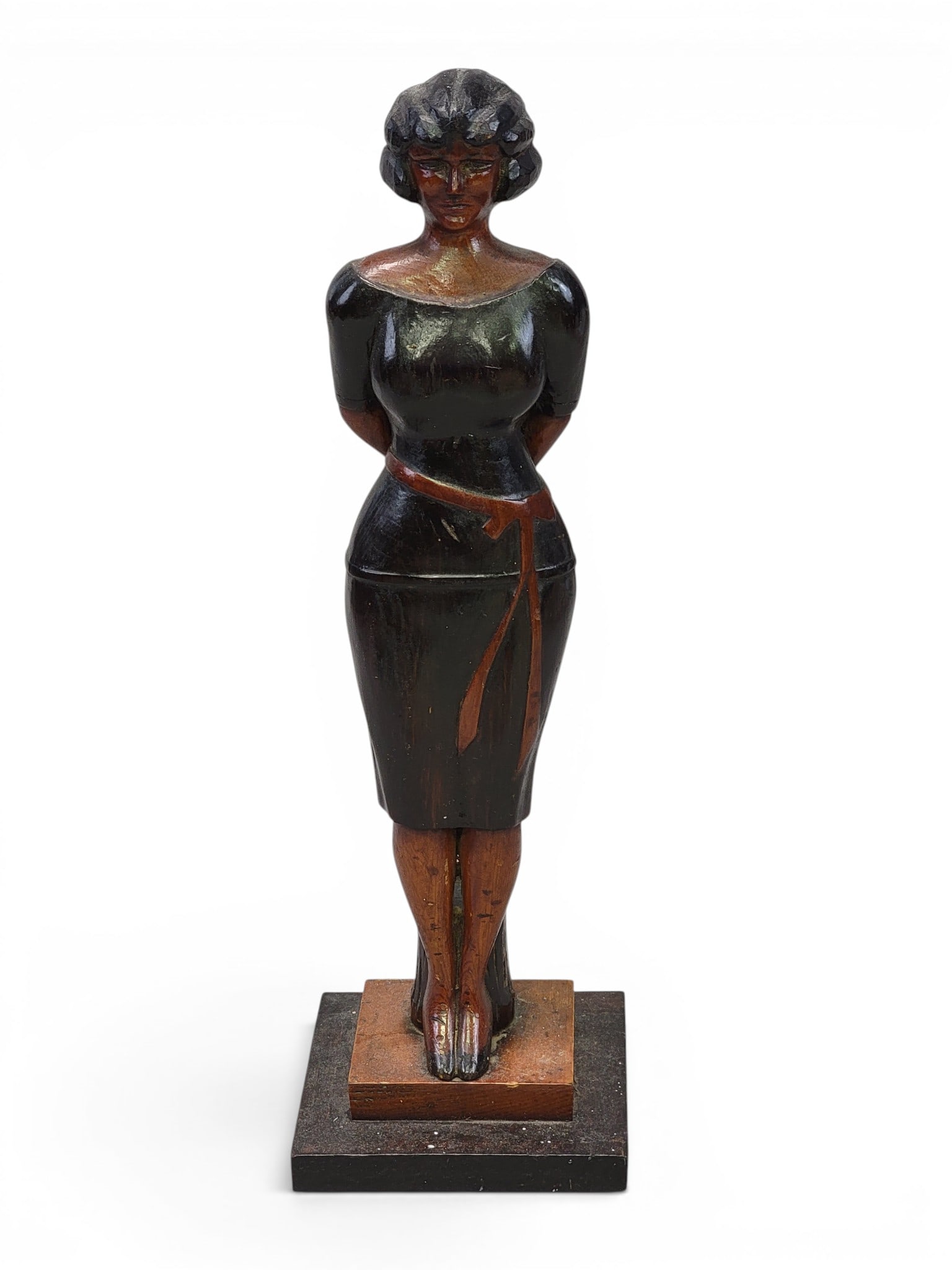 CARVED FIGURE OF A WOMAN: American, 2nd quarter-20th century, pine. Standing figure of a well-dressed woman in front of a stump. 19" high. Provenance: a Pennsylvania collection. NOTE: We are happy to answer questions and take