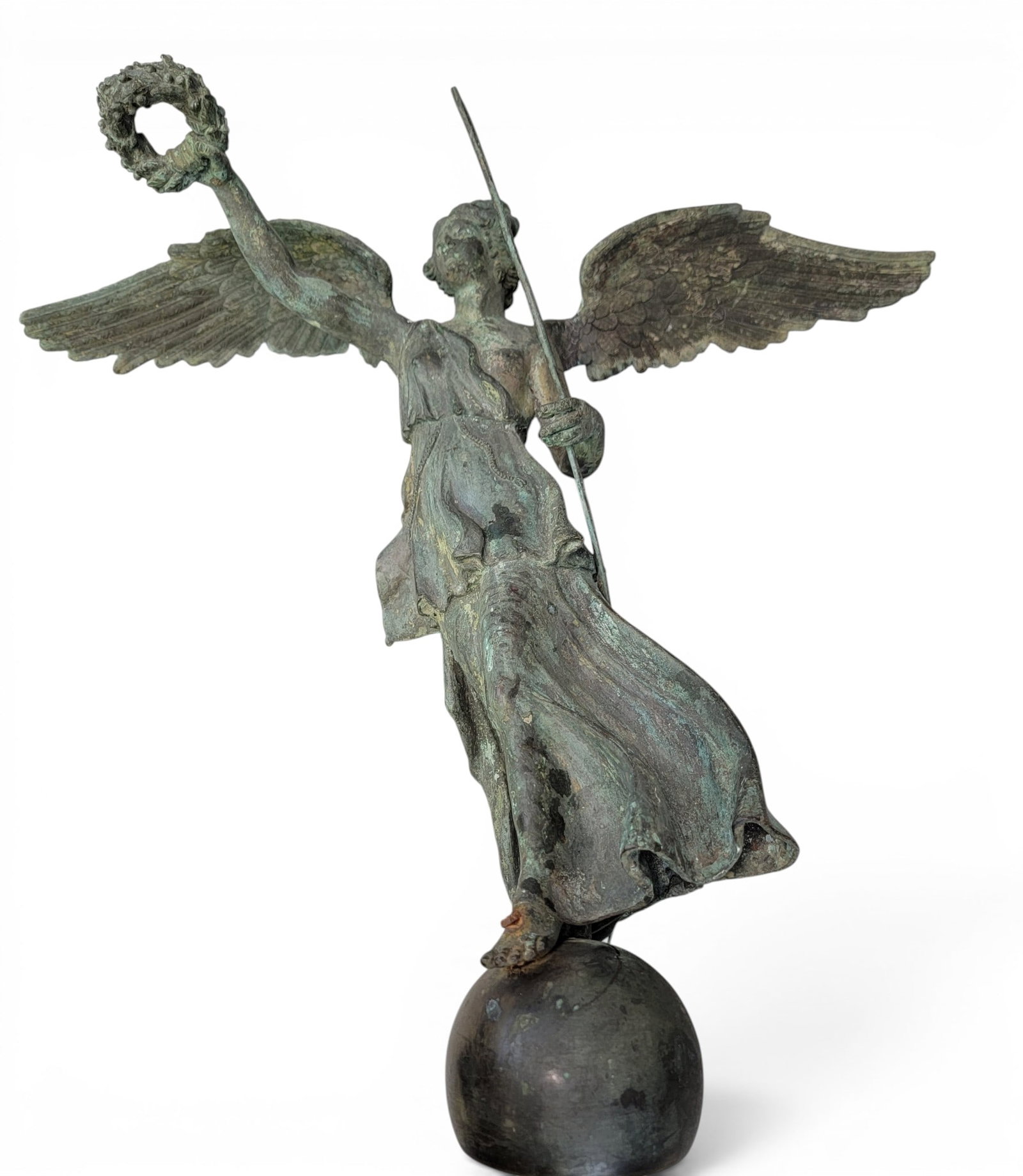 BRONZE WINGED VICTORY: Late 19th century. Likely a large finial from an outdoor sculpture, monument, or building. Classical winged figure holding a spear in her left hand and a laurel wreath in her right, standing on a