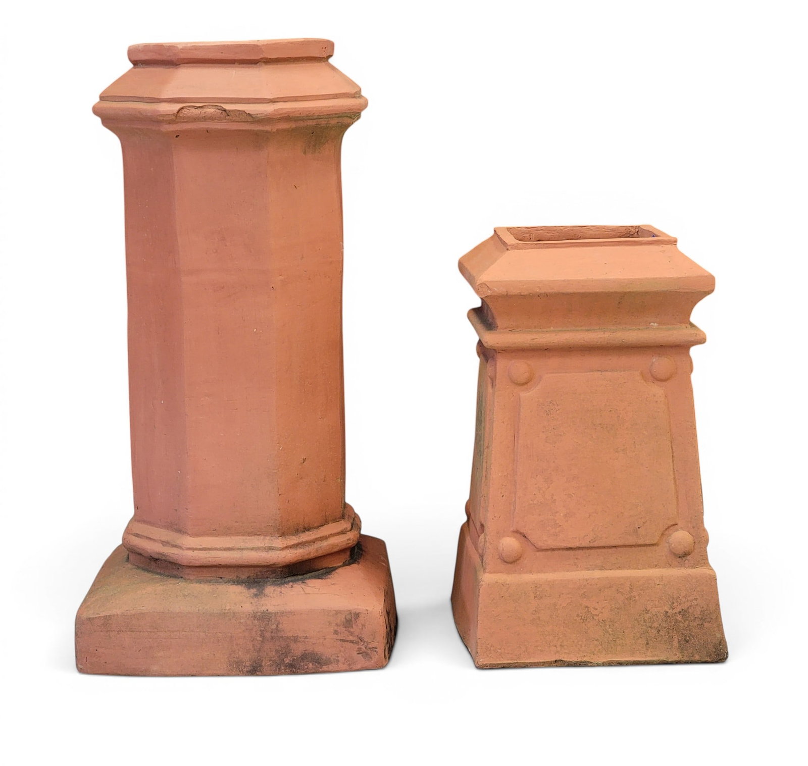 TWO TERRA COTTA CHIMNEY CAPS: One is marked for Fred Mashman, Kingsgrove, Sydney, Australia, 20th century. Of typical forms. 31.5" and 21.5" high. Provenance: a Pennsylvania collection. NOTE: We are happy to answer questions and