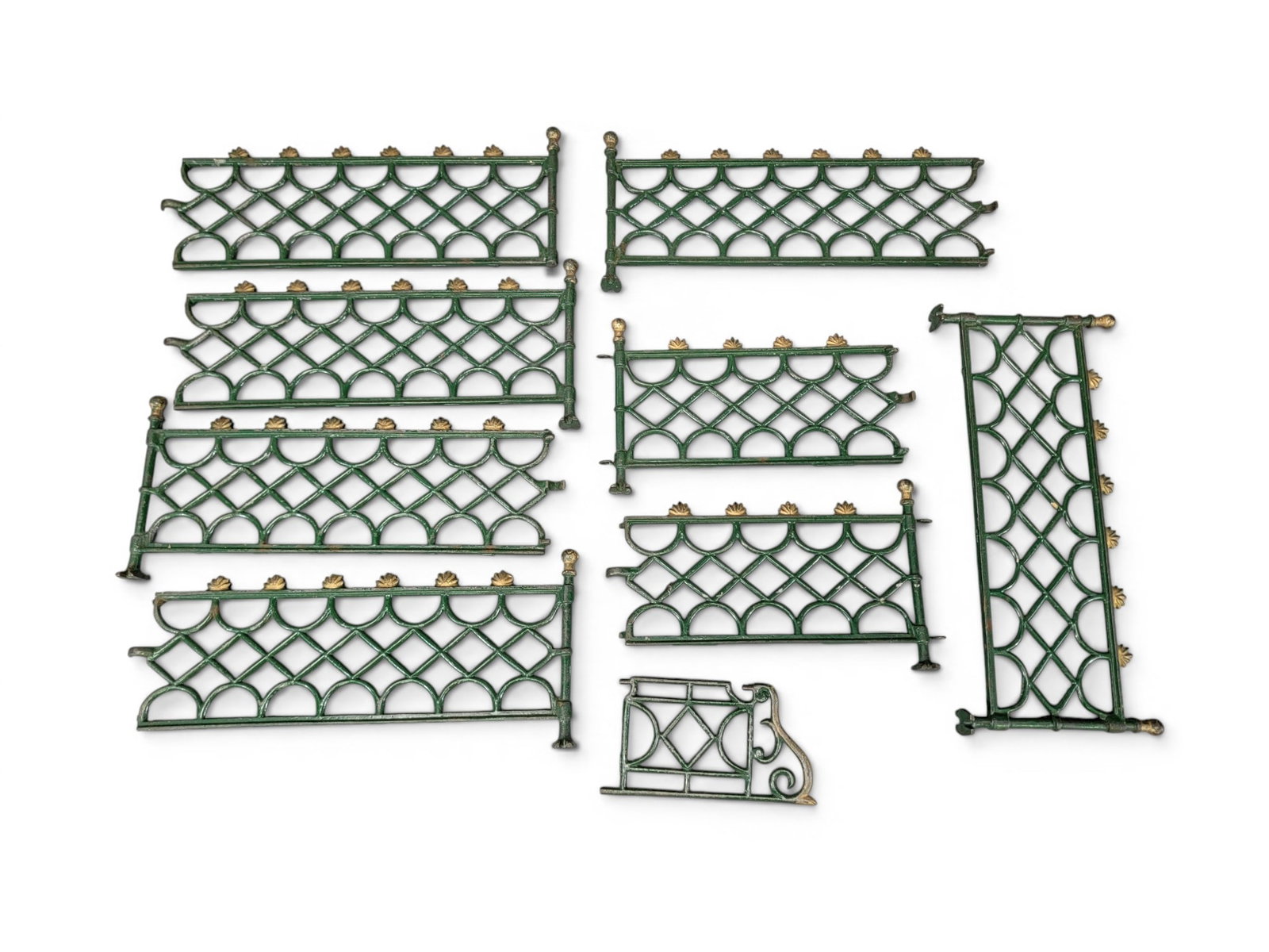 WRITING BOX AND CHRISTMAS TREE FENCE: American, 19th century. Includes a tin traveling writing box, with fitted interior, 5" high, 10.5" wide, 7.5" deep; together with a cast-iron Christmas tree fence in original green and gold paint, abo