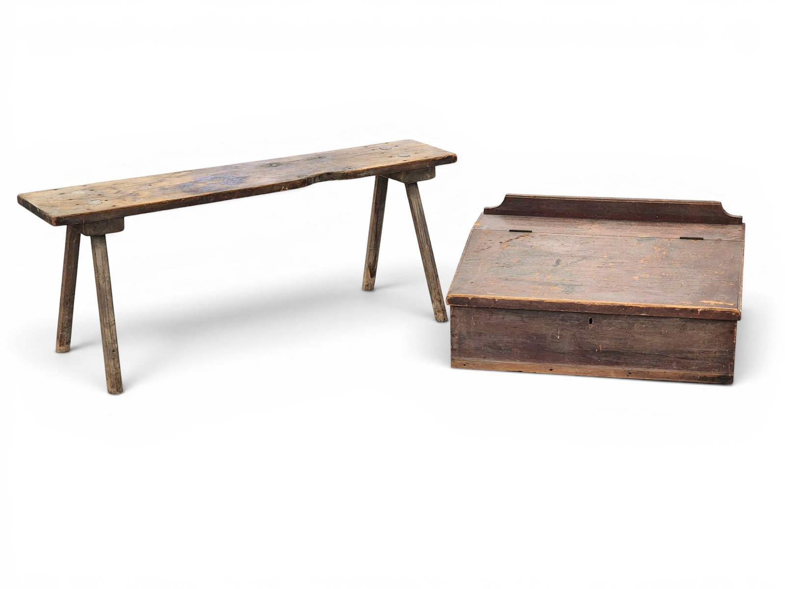 TABLE-TOP DESK AND A BENCH: American, 19th century. Includes a table-top desk with slant lid and an interior with a drawer, 14" high, 30" wide, 22" deep; together with a bench with faceted legs, 19" high, 45" long. Provenance: a