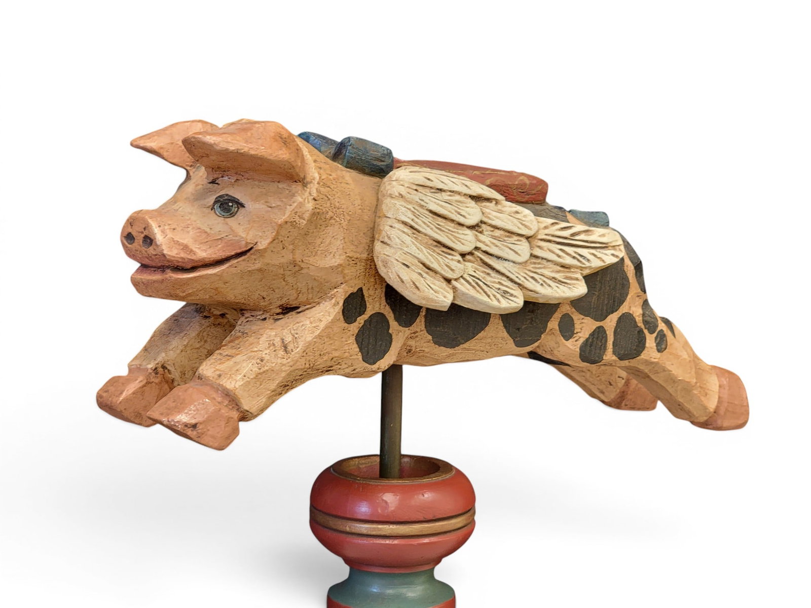 FOLK ART FLYING PIG: American, 20th century. Charming carved and painted flying pig on a carved and painted stand. 75" high overall. Provenance: an Ohio collection; purchased from the artist at the Zoar Harvest Festival