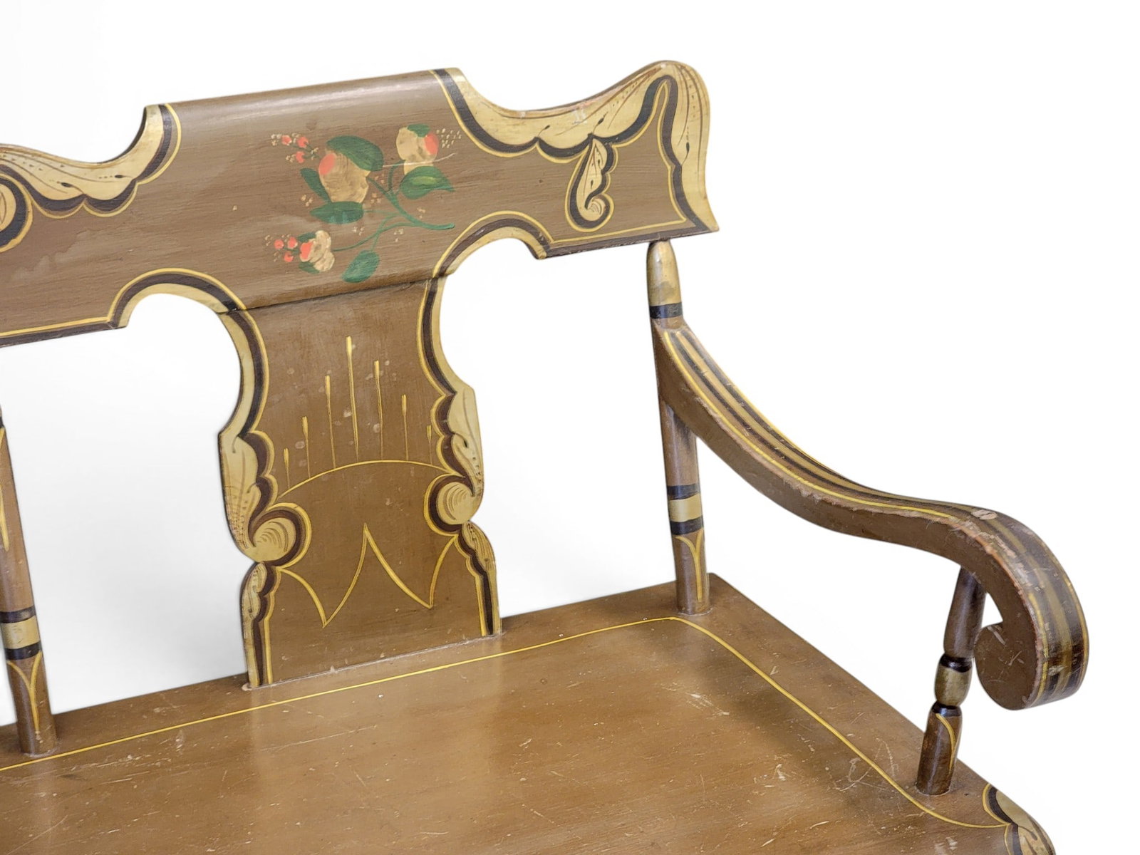 DECORATED SETTEE: Pennsylvania, 1820-1840, mixed woods including poplar. Solid splats and turned legs, and with its original floral paint on a brown ground. 35" high, 20" deep, 75" long. Provenance: an Ohio collection.