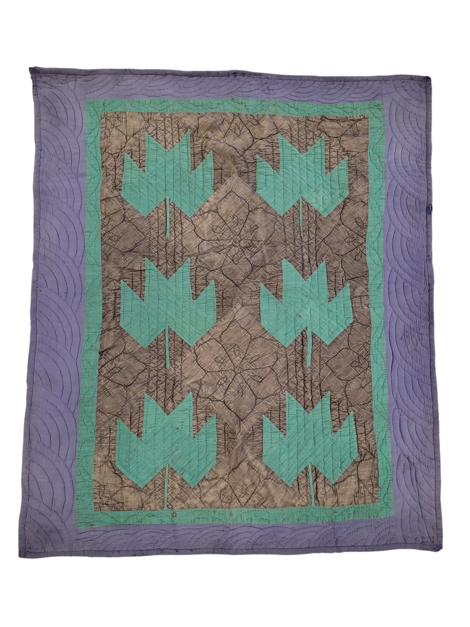 AMISH CRIB QUILT: Possibly Iowa, 20th century. Green leaves against black ground and with a blue border. 40" by 34". Provenance: a Wisconsin collection. NOTE: We are happy to answer questions and take additional