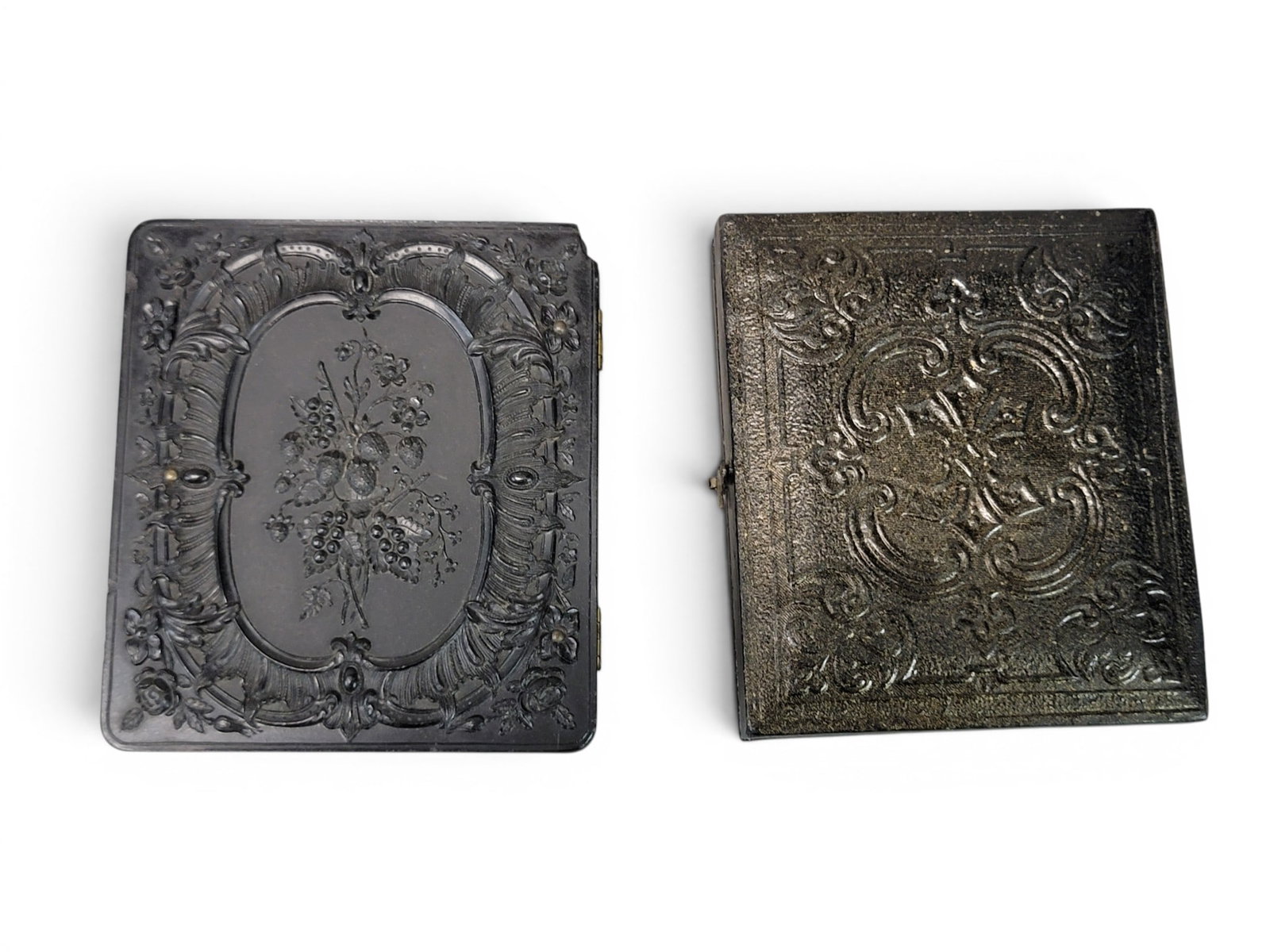 TWO EARLY CASED PHOTOGRAPHS: American, mid-19th century. Both ninth plate. Includes an ambrotype of a handsome gentleman with a big tie, and in thermoplastic union case; together with a tinted tintype of a husband and wife, the h