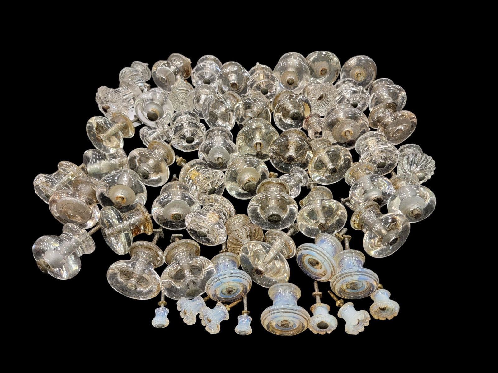 LARGE COLLECTION OF GLASS FURNITURE PULLS: American, 19th century. Mostly blown and likely Pittsburgh, some are pressed, and some are pressed and opalescent. Provenance: a Wisconsin collection. NOTE: We are happy to answer questions and take