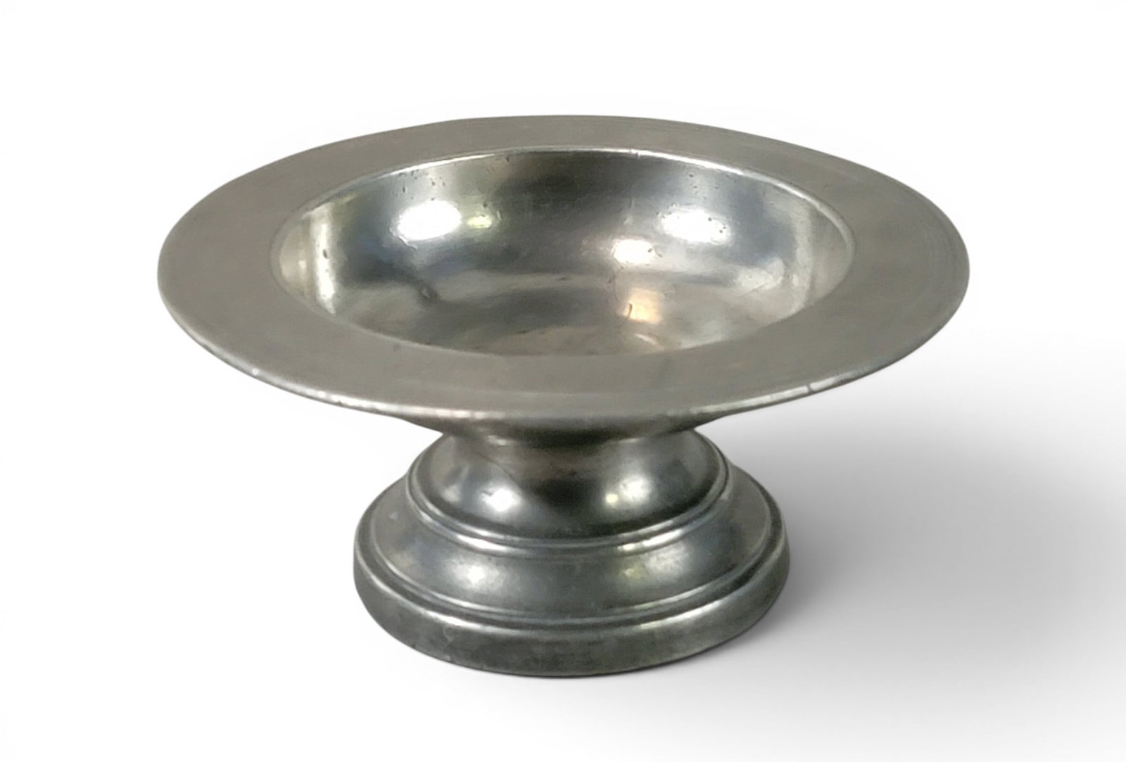 EARLY PEWTER MASTER SALT CELLAR: Unidentified mark (1636 over WS over a hand and axe), European, 17th century. Wide-rimmed salt on a round pedestal. 2.25" high, 5" diameter. Provenance: an Ohio collection. NOTE: We are happy to