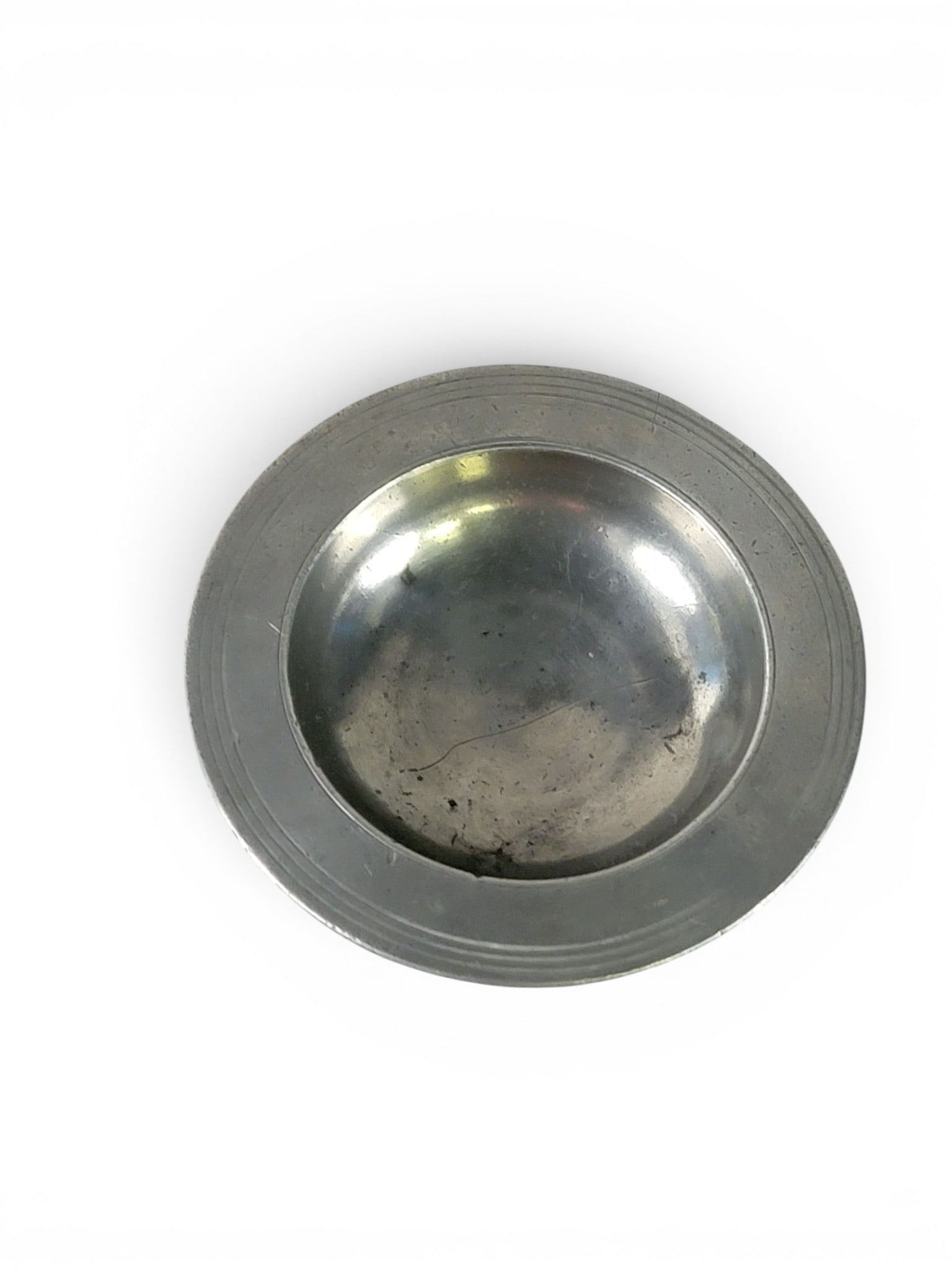 EARLY PEWTER MASTER SALT CELLAR: Unidentified mark (1636 over WS over a hand and axe), European, 17th century. Wide-rimmed salt on a round pedestal. 2.25" high, 5" diameter. Provenance: an Ohio collection. NOTE: We are happy to answe