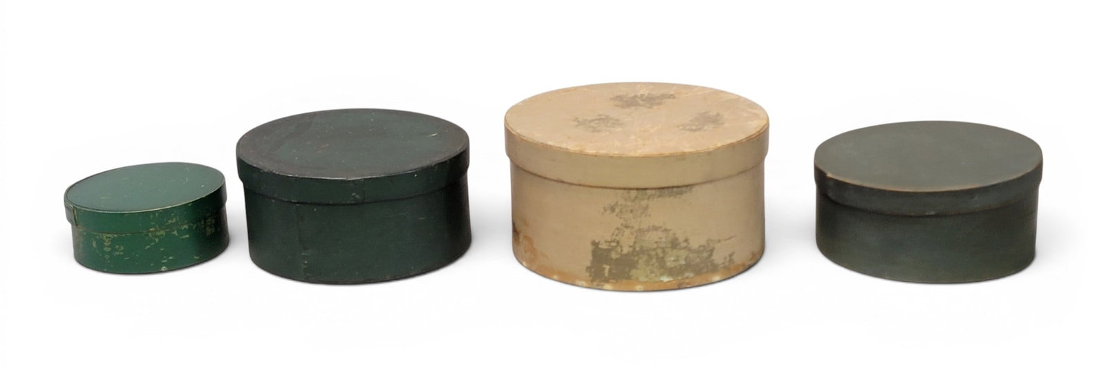 FOUR PANTRY BOXES: American, 19th century, bentwood. All with old paint. 5.75" to 9.75" diameter. Provenance: an Ohio collection. NOTE: We are happy to answer questions and take additional photos of lots prior to the