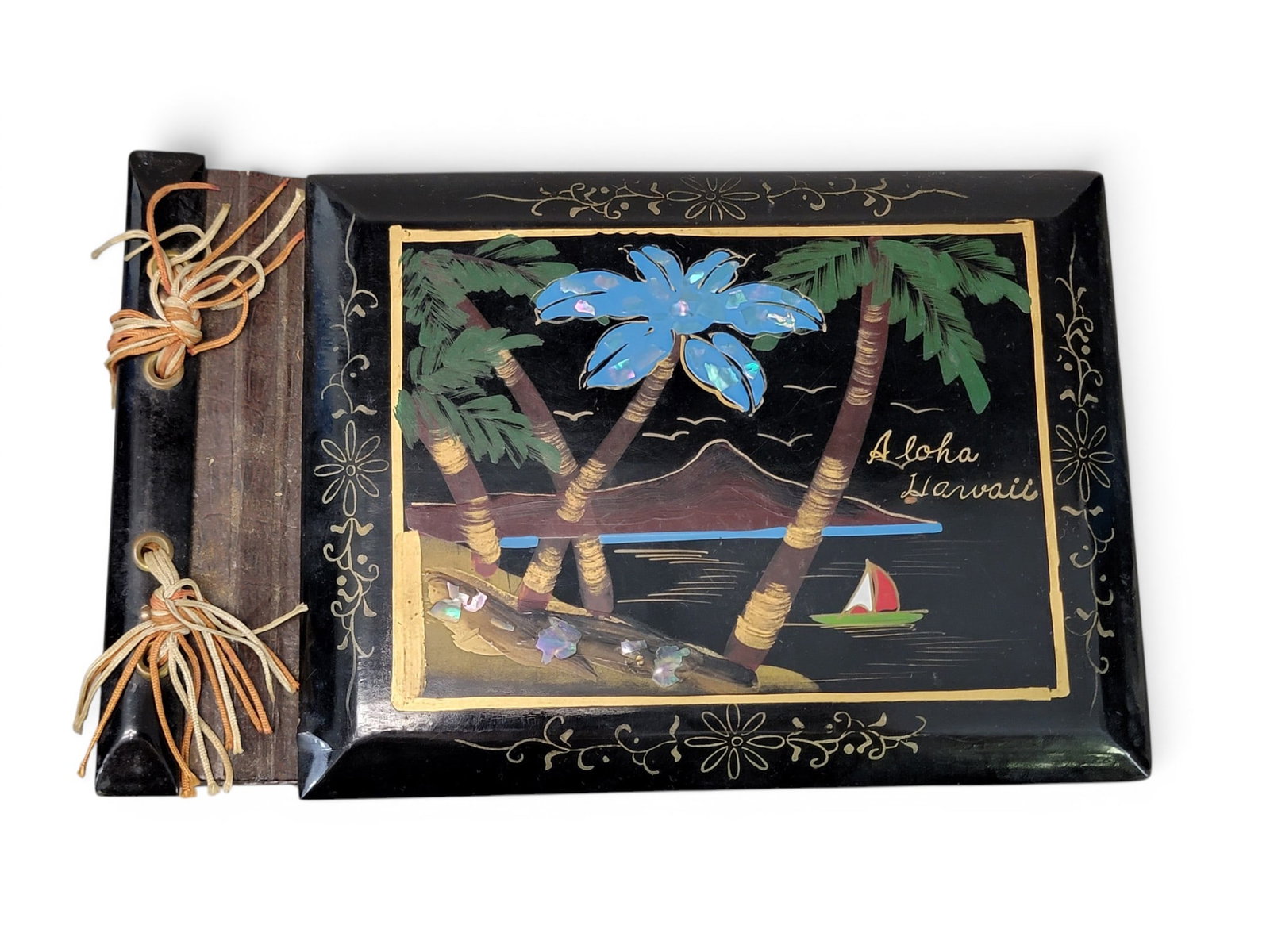 PHOTOGRAPHS AND EPHEMERA: American, 19th-20th century. Includes a watercolor assemblage portrait of two children; an "Aloha Hawaii" photo album; a US flag music box; an early 20th century photo of a child and their toys; and t