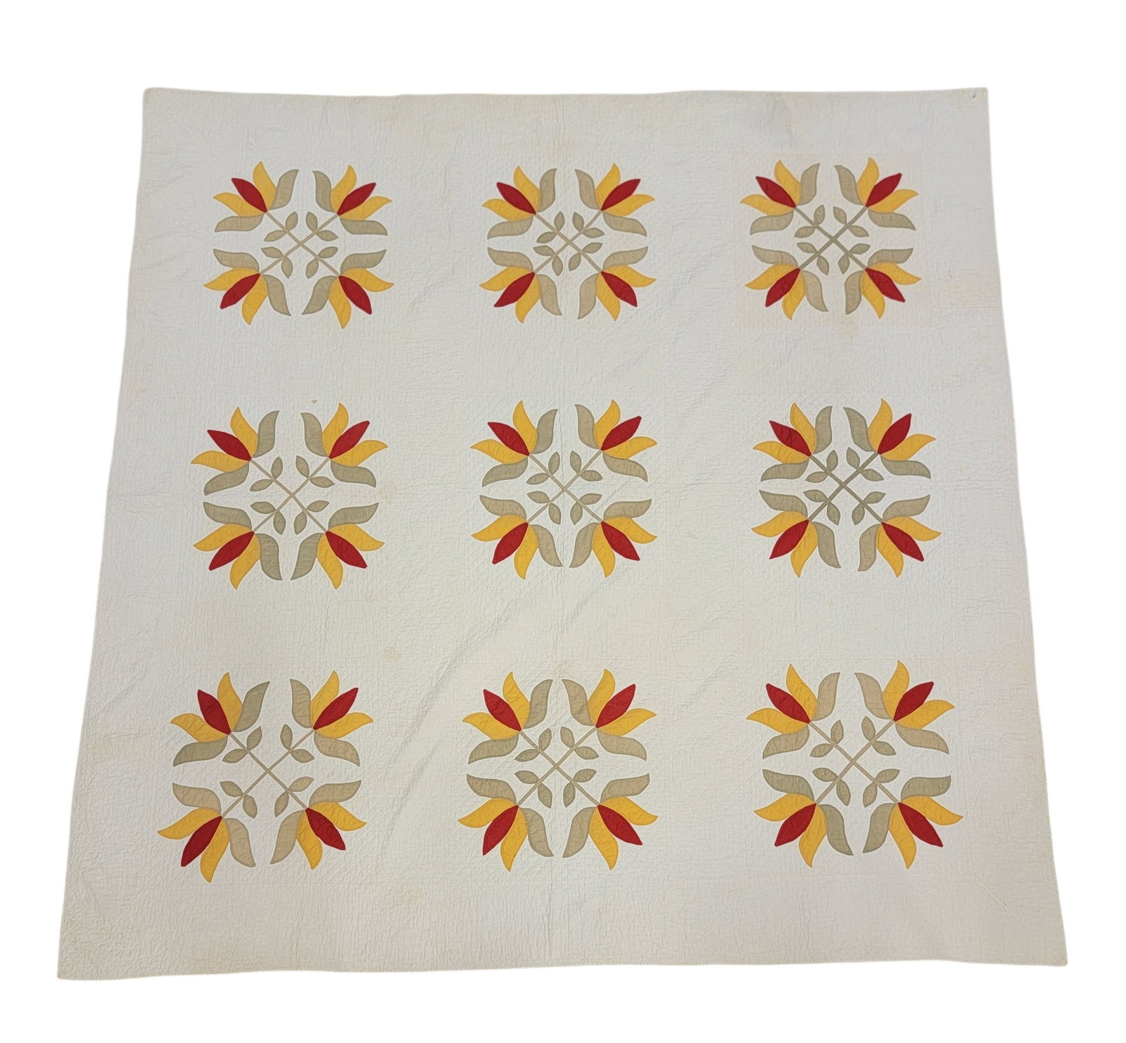 FLORAL APPLIQUE QUILT: American, late 19th century, cotton. Green, cheddar, and red tulip medallions. 82" square. Provenance: a southeast Ohio family. NOTE: We are happy to answer questions and take additional photos of