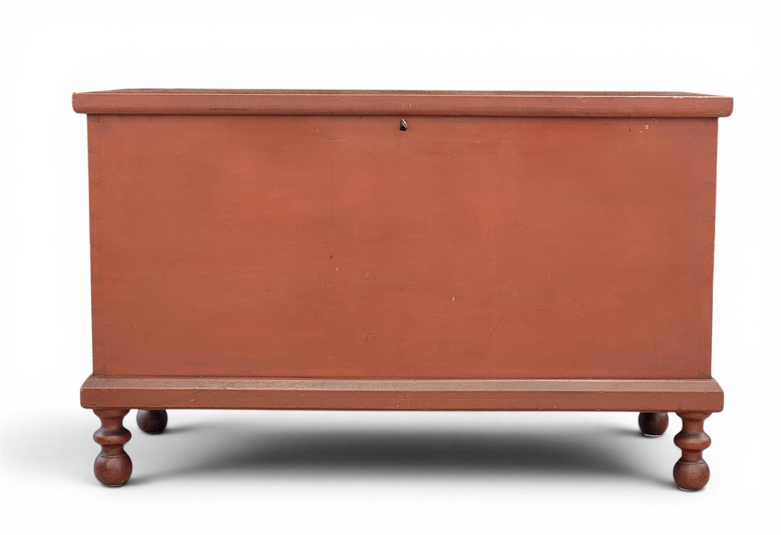 PAINTED BLANKET CHEST WITH AMUSING INSCRIPTION: American, 1865, pine. Dovetailed chest, turned feet, and original red paint. 27" high, 43.75" wide, 19.75" deep. Inscribed on the inside "Jacob Hofmann for another house 1865 this chest shall never