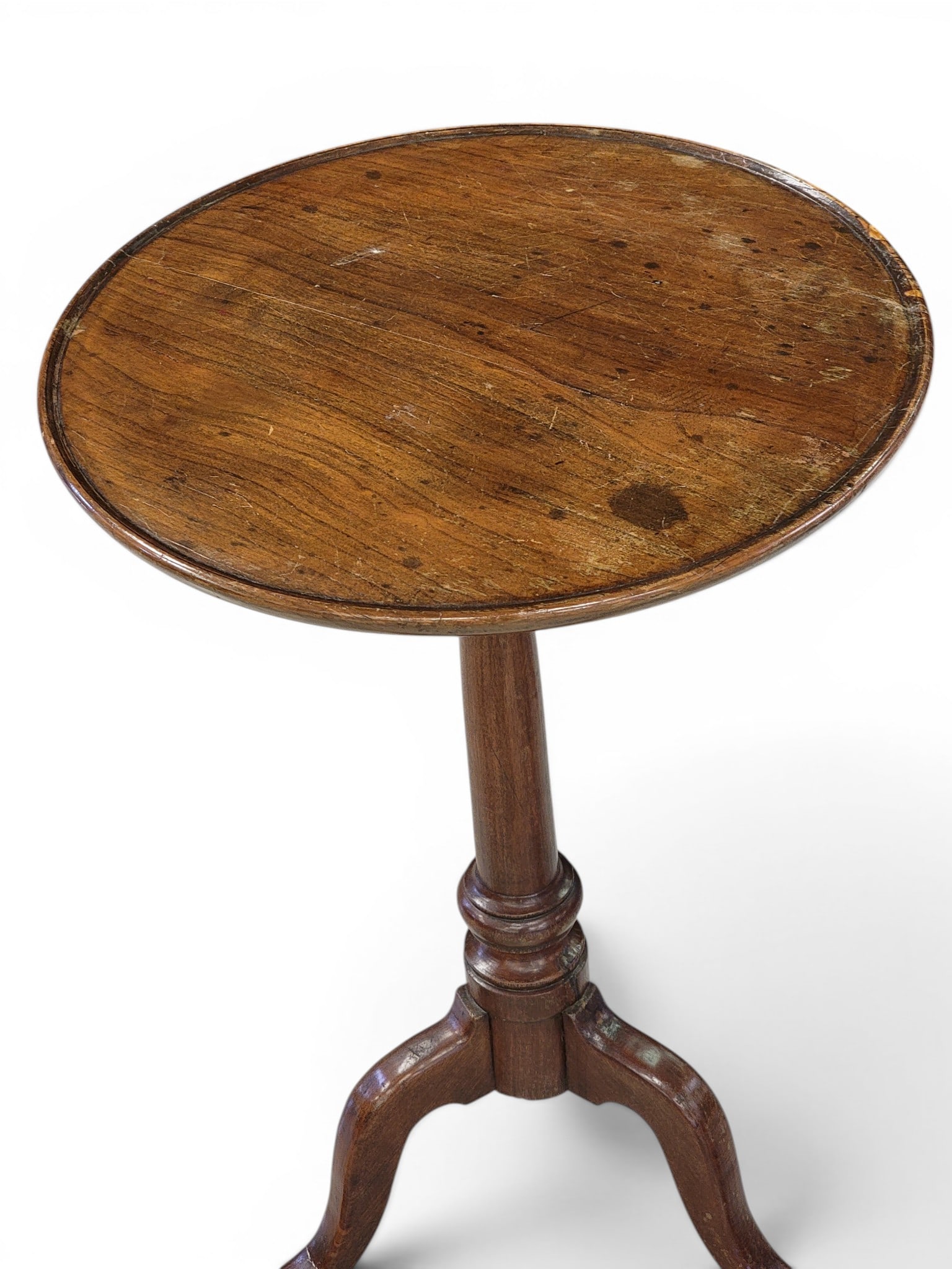 TWO CANDLESTANDS: American, 19th century. Includes a poplar, dish-top stand with tripod base, 25.25" high; together with a classical curly maple tilt-top stand with octagonal top and splayed legs on ball feet, 27.75"