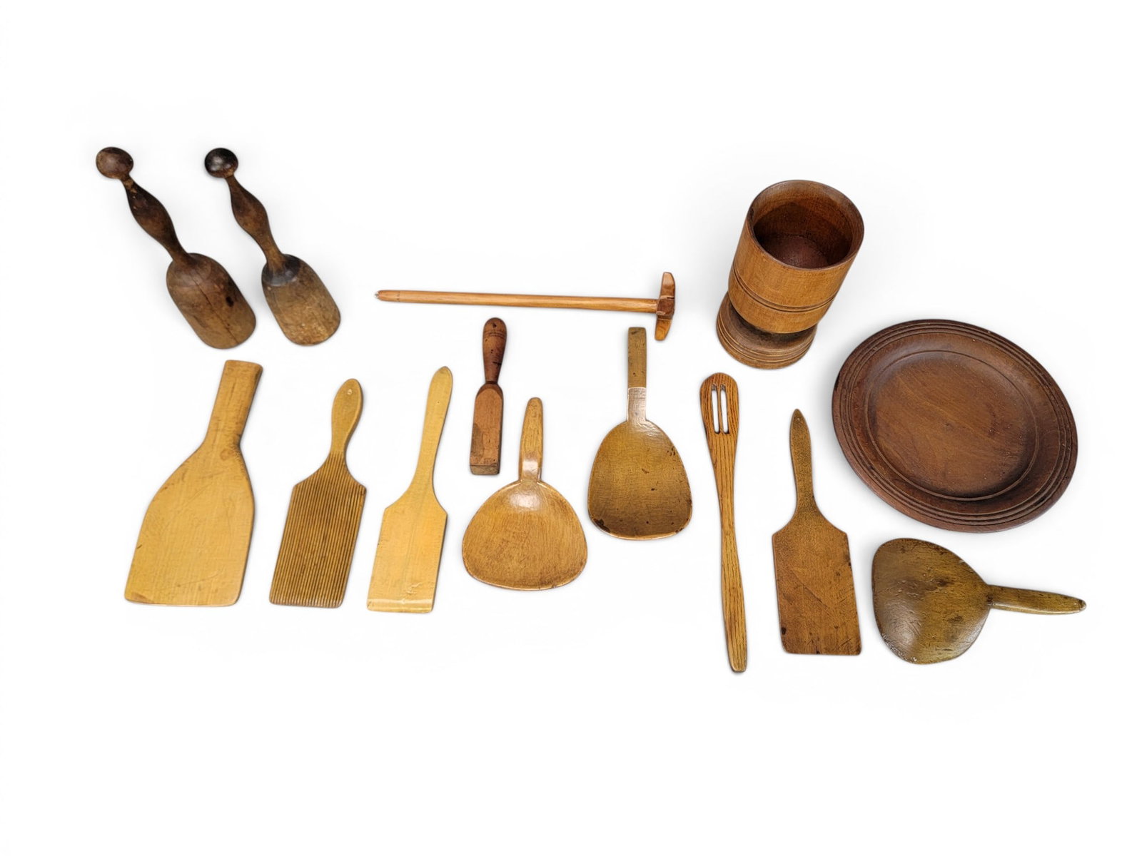 COLLECTION OF TREENWARE: 19th century. Includes a plate, a pestle, two mortars, and various small tools. Plate is 10" diameter. Provenance: from the collection of Diane Whyte Miller (Virginia). NOTE: We are happy to answer