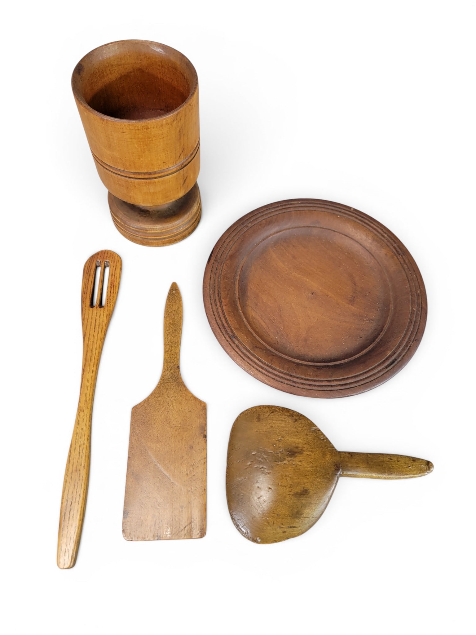 COLLECTION OF TREENWARE: 19th century. Includes a plate, a pestle, two mortars, and various small tools. Plate is 10" diameter. Provenance: from the collection of Diane Whyte Miller (Virginia). NOTE: We are happy to answer qu