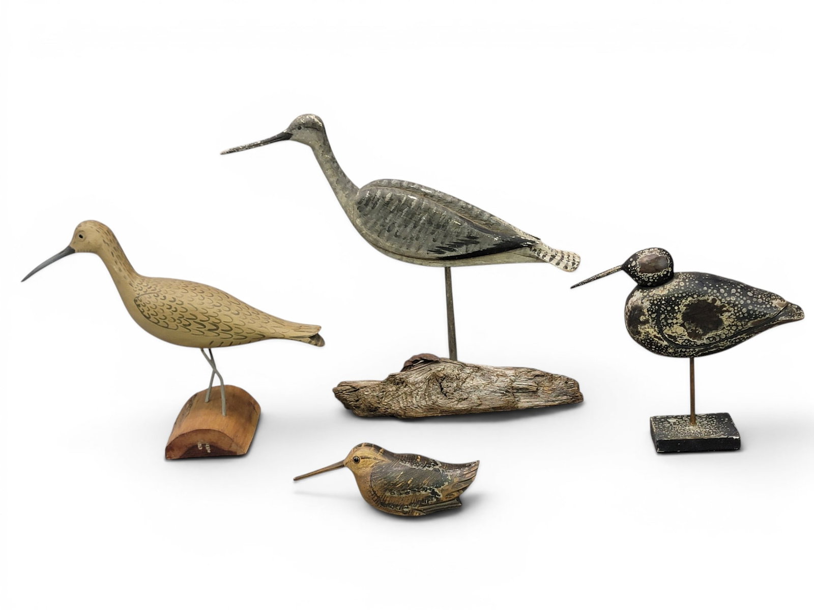 THREE SHOREBIRDS AND A WOODCOCK: All contemporary. Includes a woodcock by Will Kirkpatrick, a curley by Harry V. Shourds; an unsigned yellowlegs; and a willet signed "RA". Willet is 16.5" high. Provenance: from the collection of