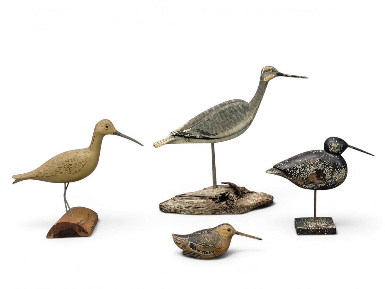 THREE SHOREBIRDS AND A WOODCOCK: All contemporary. Includes a woodcock by Will Kirkpatrick, a curley by Harry V. Shourds; an unsigned yellowlegs; and a willet signed "RA". Willet is 16.5" high. Provenance: from the collection of