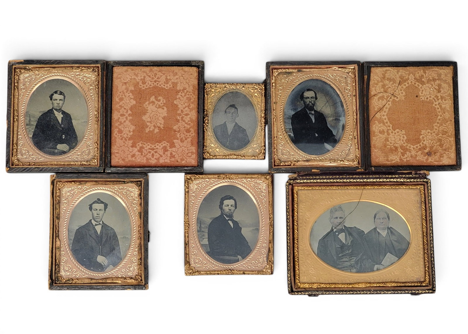 COLLECTION OF EARLY PHOTOGRAPHS: American, mid-19th century. Includes a quarter plate ambrotype of a couple, four sixth plate tintypes of gentlemen, and a ninth plate tintype of a gentleman. Provenance: a West Virginia collection.