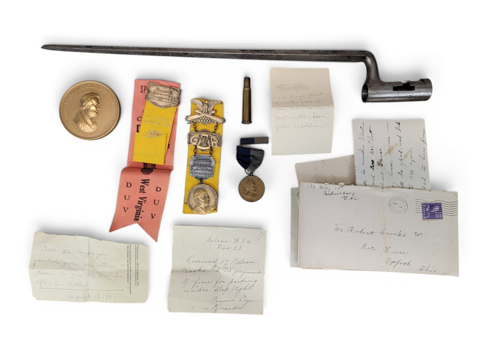 ARCHIVE RELATED TO WILLIAM SATOW, 1ST WV CALVALRY: A miscellany of items, including Satow?s bayonet, his Civil War campaign medal (and a letter from the War Department referencing the medal), badges from the 70th GAR encampment in Washington, DC in