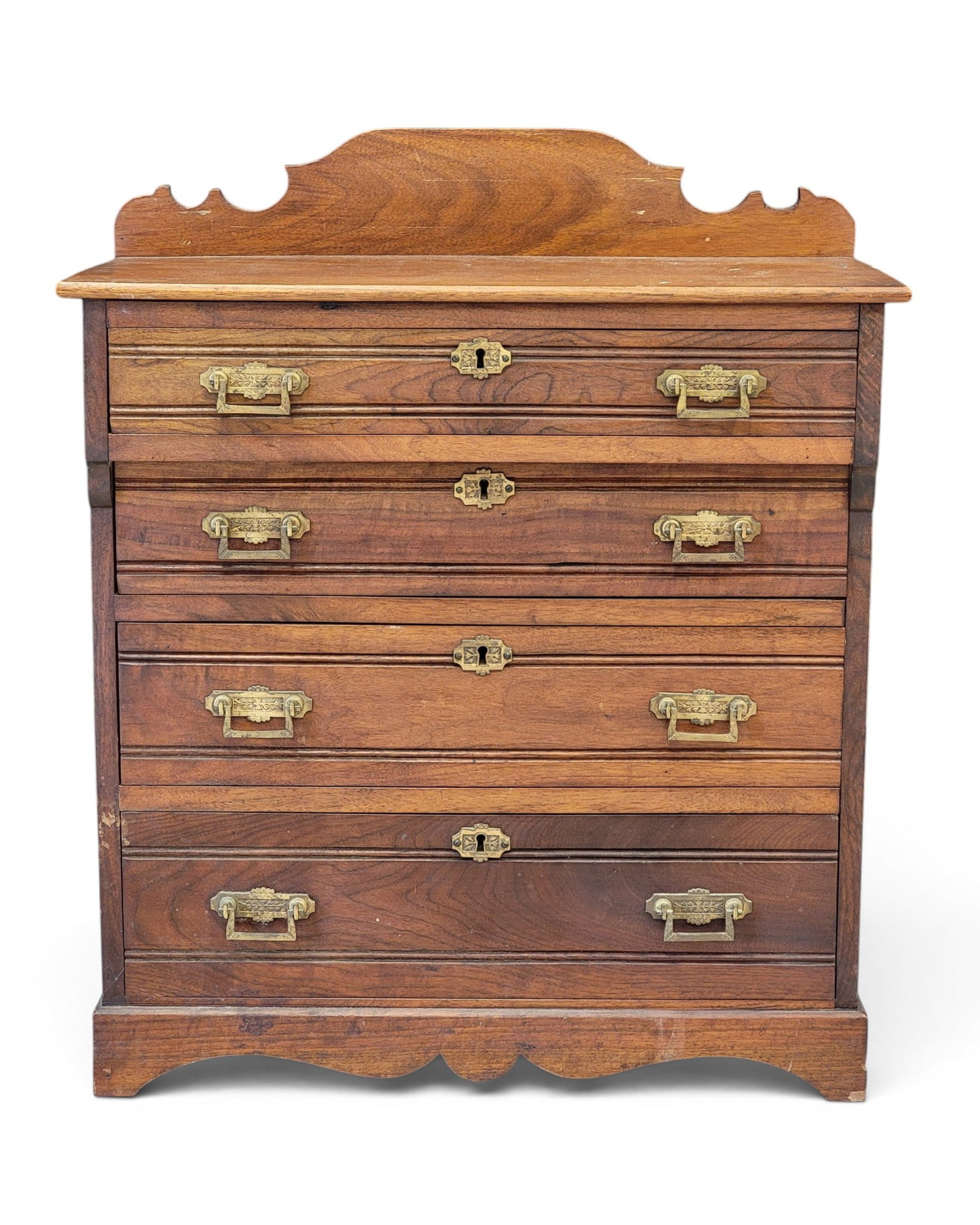 VICTORIAN CHILD'S CHEST OF DRAWERS: American, late 19th century, walnut and poplar. Eastlake style, with four drawers and original pulls. 28.25" high, 24" wide, 12" deep. Provenance: a northeast Ohio collection. NOTE: We are happy to