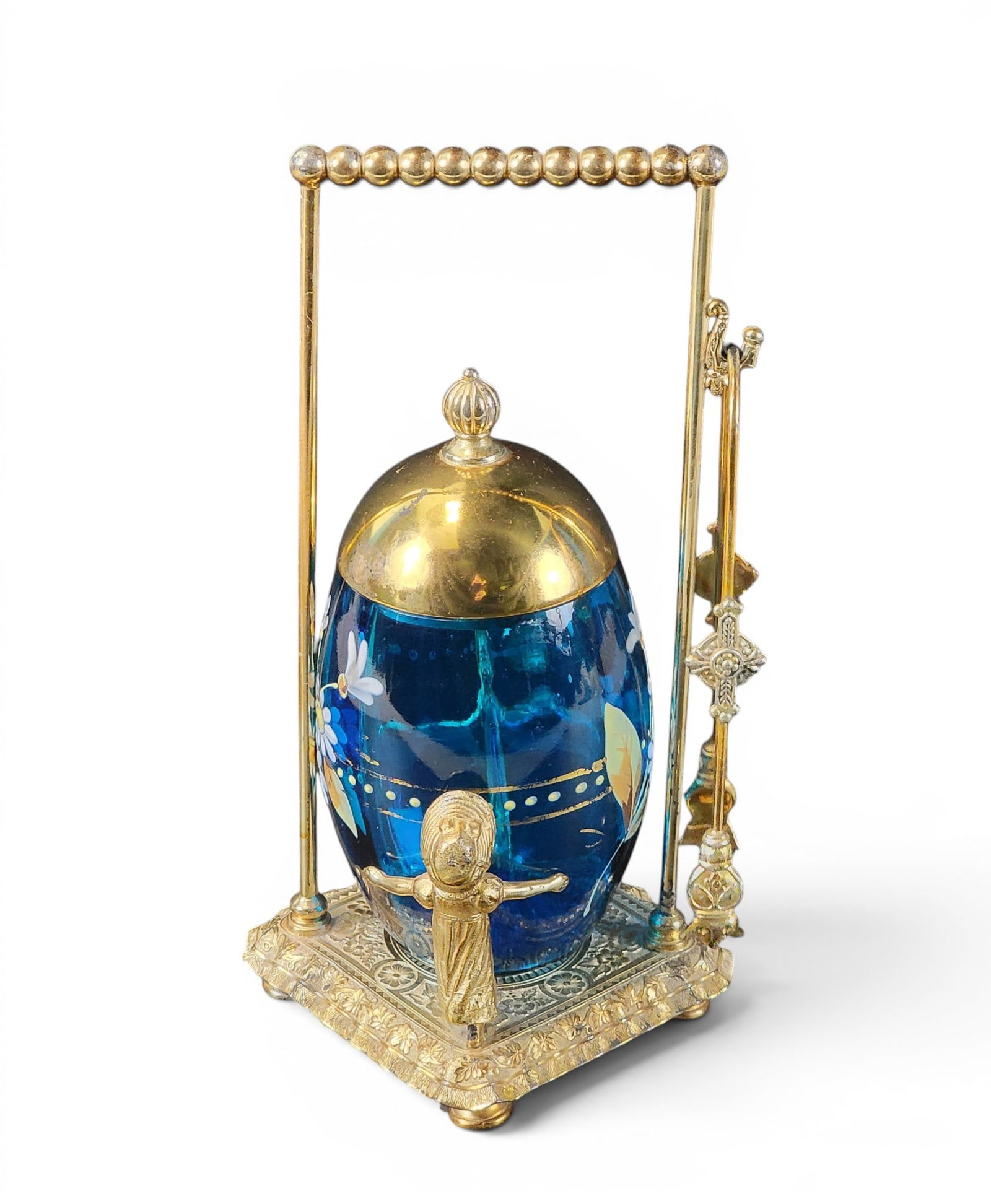 VICTORIAN ART GLASS PICKLE CASTER: American, late 19th century. Deep aqua glass jar with enameled daisies, in a gilt silver-plated frame by James. Tufts of Boston. 9.75" high. Provenance: a northeast Ohio collection. NOTE: We are