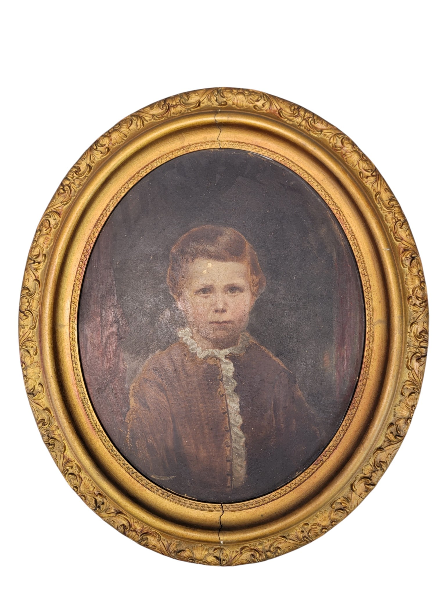 TWO PORTRAITS OF CHILDREN: American, late 19th century, oils on artist board. Both oval format, includes a portrait of a young lady in a red dress, in its original gilt frame with a Cleveland framer's label, 23.25" high, 19.5" 