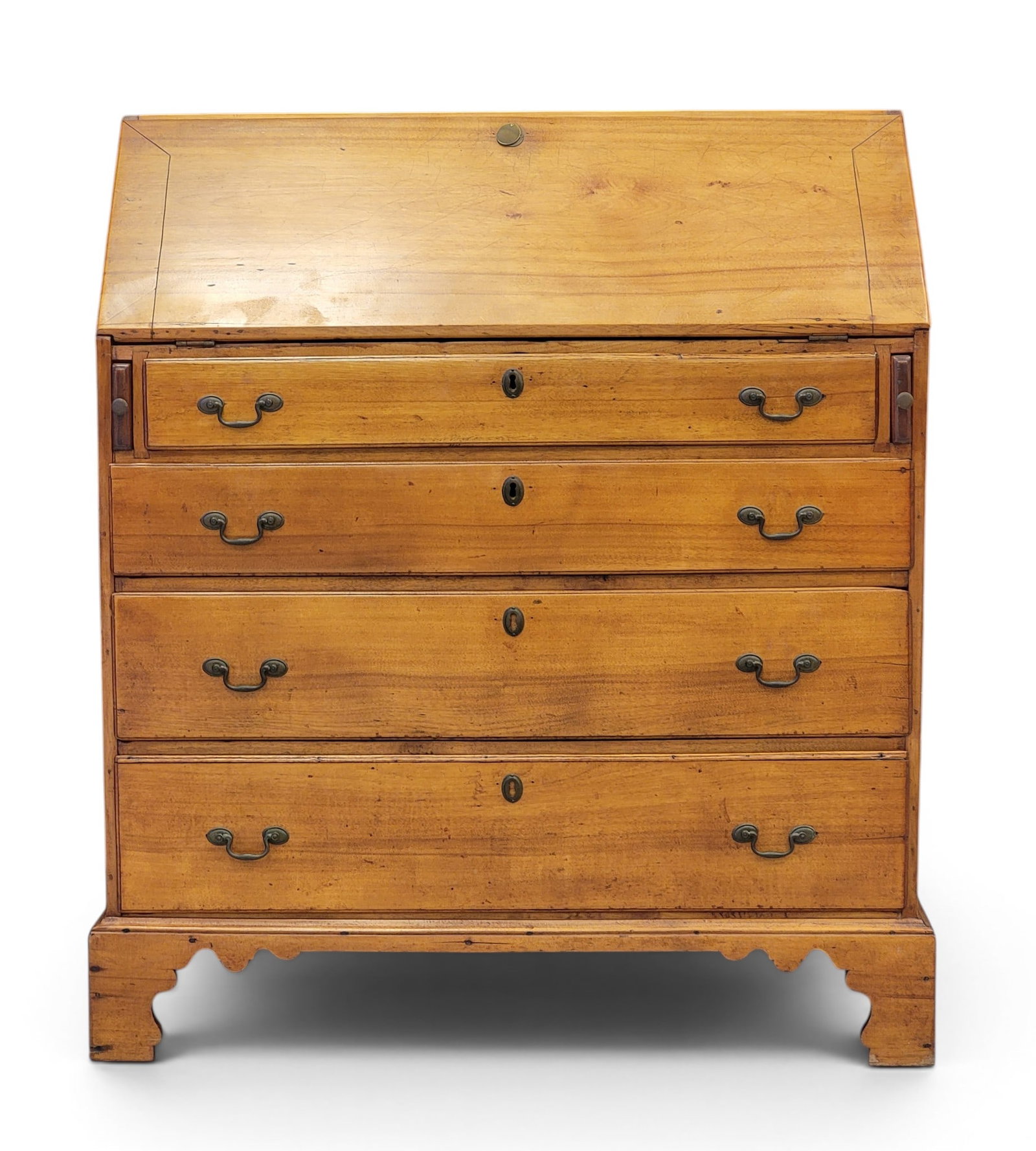 CHIPPENDALE SLANT-FRONT DESK: New England, late 18th century, maple and pine. Dovetailed case, the interior with cubbies and slots, and with four graduated drawers, all on a nicely shaped bracket base. 43.5" high, 37" wide, 19.5"