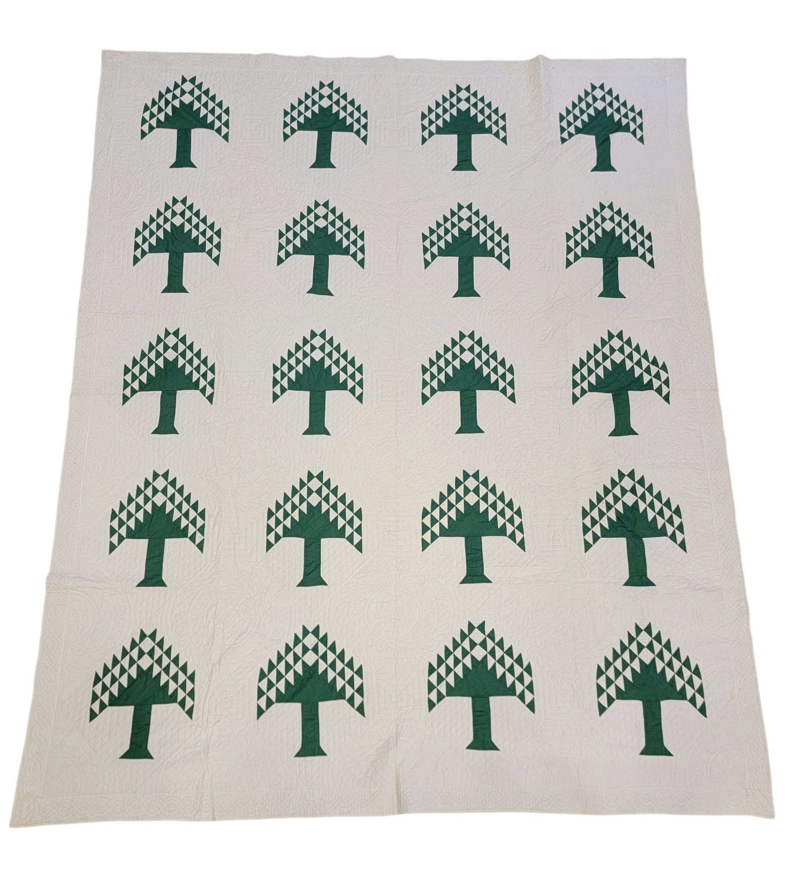 "PINE TREE" QUILT: American, 1920s, cotton. Hand-pieced, elaborately hand-quilted, with green pine trees. 111" by 89". Provenance: an Ohio collection. NOTE: We are happy to answer questions and take additional photos of