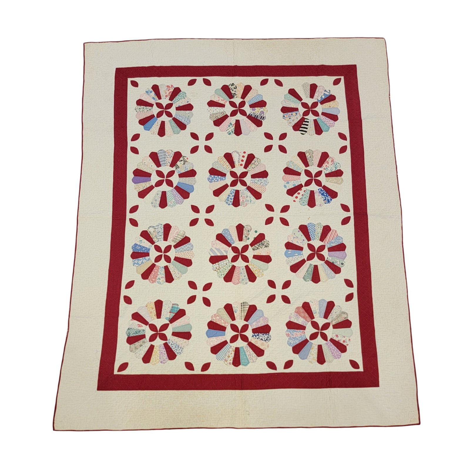 "DRESDEN PLATE" QUILT: American, c. 1930, cotton. hand-applique and hand-quilted, in bright red and flour sack fabrics. 84" by 68". Provenance: an Ohio collection. NOTE: We are happy to answer questions and take additional