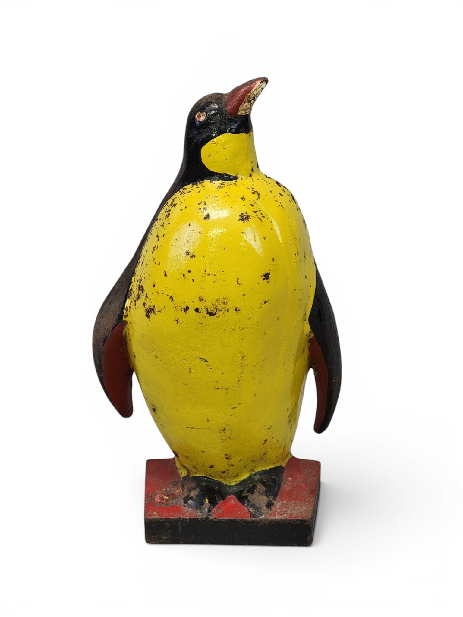 TAYLOR COOK PENGUIN DOORSTOP: 1930, cast iron. No. 1, with original polychrome paint. 9.5" high. Provenance: a Pennsylvania collection. NOTE: We are happy to answer questions and take additional photos of lots prior to the