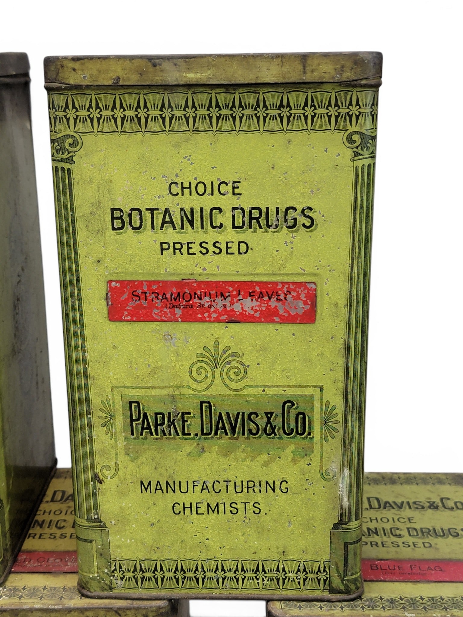 11 APOTHECARY TINS: Early 20th century. For Park, Davis & Co. Square, printed, green tins, each with the contents labeled on the front and top. 9" high each. Provenance: a Pennsylvania collection. NOTE: We are happy to a