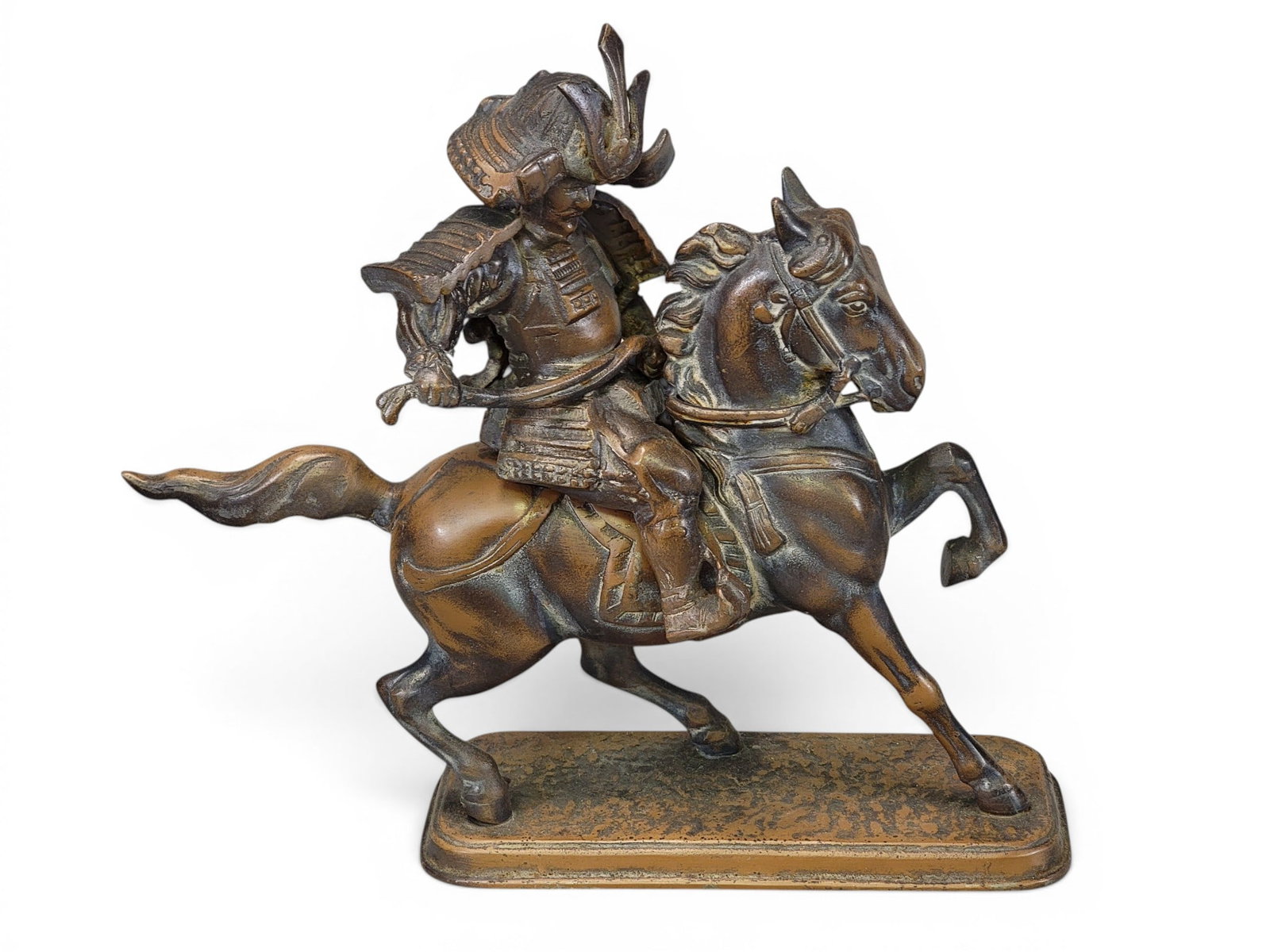 TWO JAPANESE SCULPTURAL WORKS: Includes a Meiji period bronze candlestick with a lobed design, with dragon, birds, ladies, flowers, and turtles, 10" high; together with a bronze-patinated samurai on horseback, 13" long. Provenance: