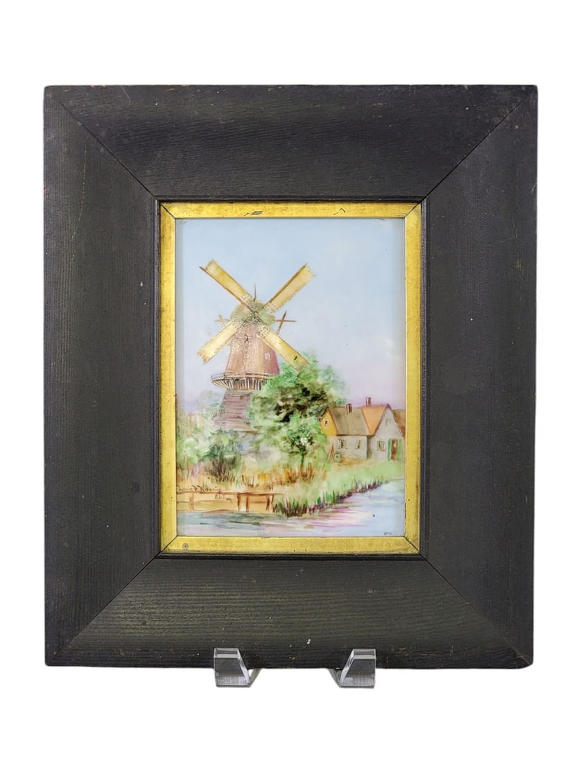 HANDPAINTED PORCELAIN PLAQUE WITH WINDMILL: Plaque marked for Tressemanes and Vogt, Limoge, France; painting signed Louis F. Koenig, c. 1900. Depiction of a windmill in spring. 7" high, 5" wide (plaque); in its original frame, 12.75" high,