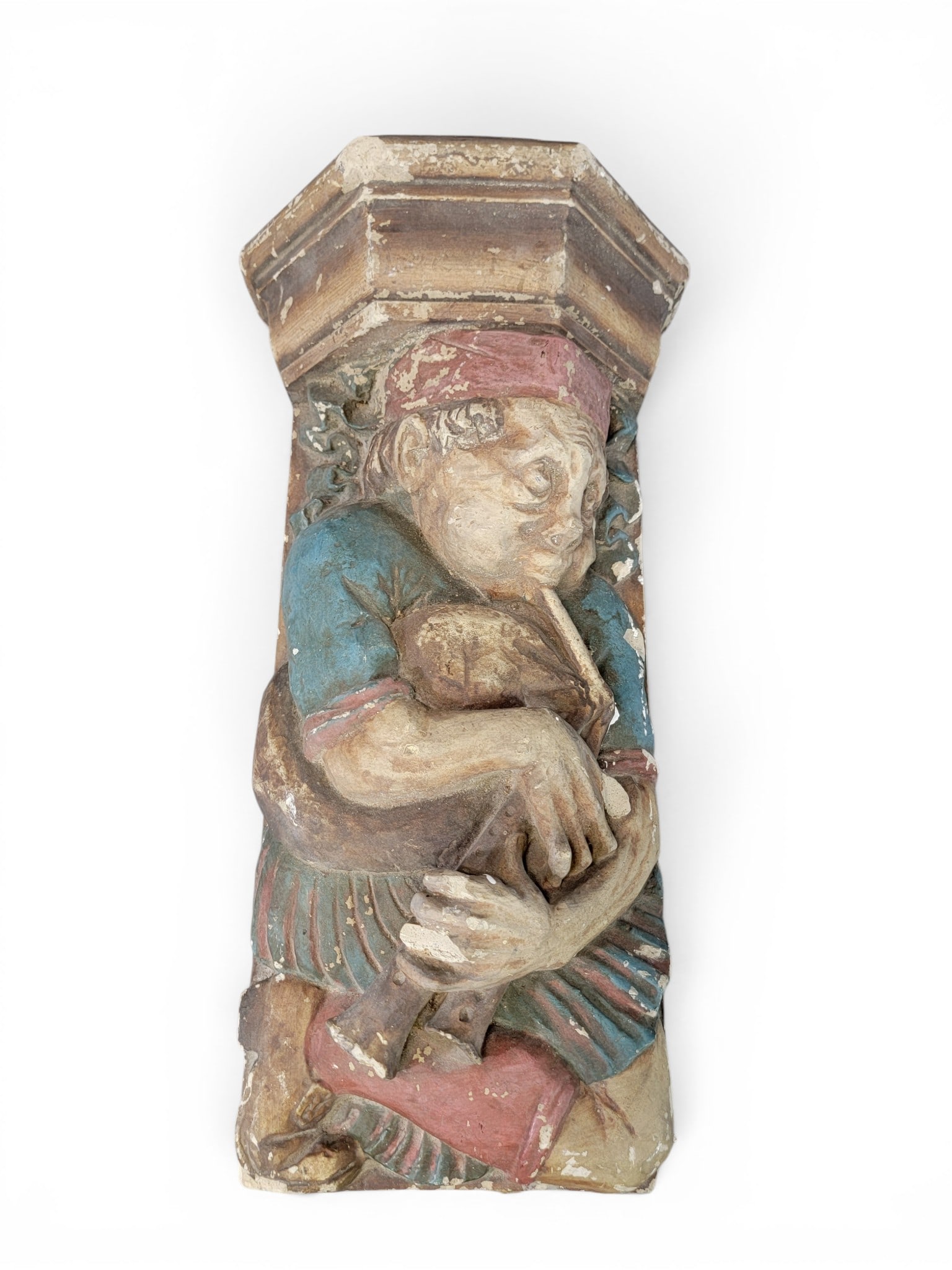 CHALKWARE ARCHITECTURAL BRACKET: European, late 19th-early 20th century. Grotesque figure with original paint. 22" high. Provenance: an Ohio collection. NOTE: We are happy to answer questions and take additional photos of lots prior